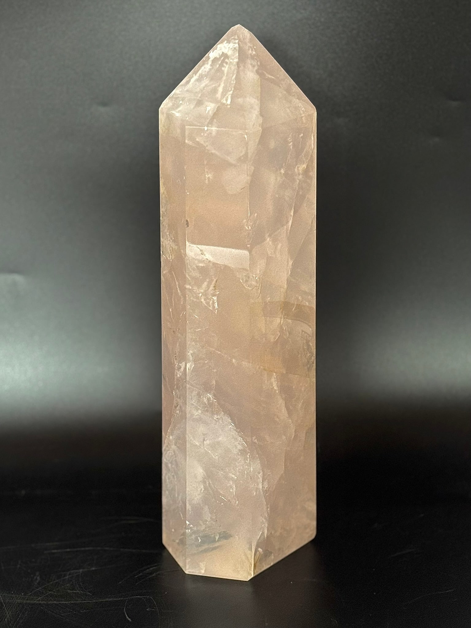Large Translucent Rose Quartz Obelisk With Inclusions: Large translucent rose quartz crystal obelisk with inclusions. 12.75” x 4” x 3”. 9 pounds, 7 ounces.