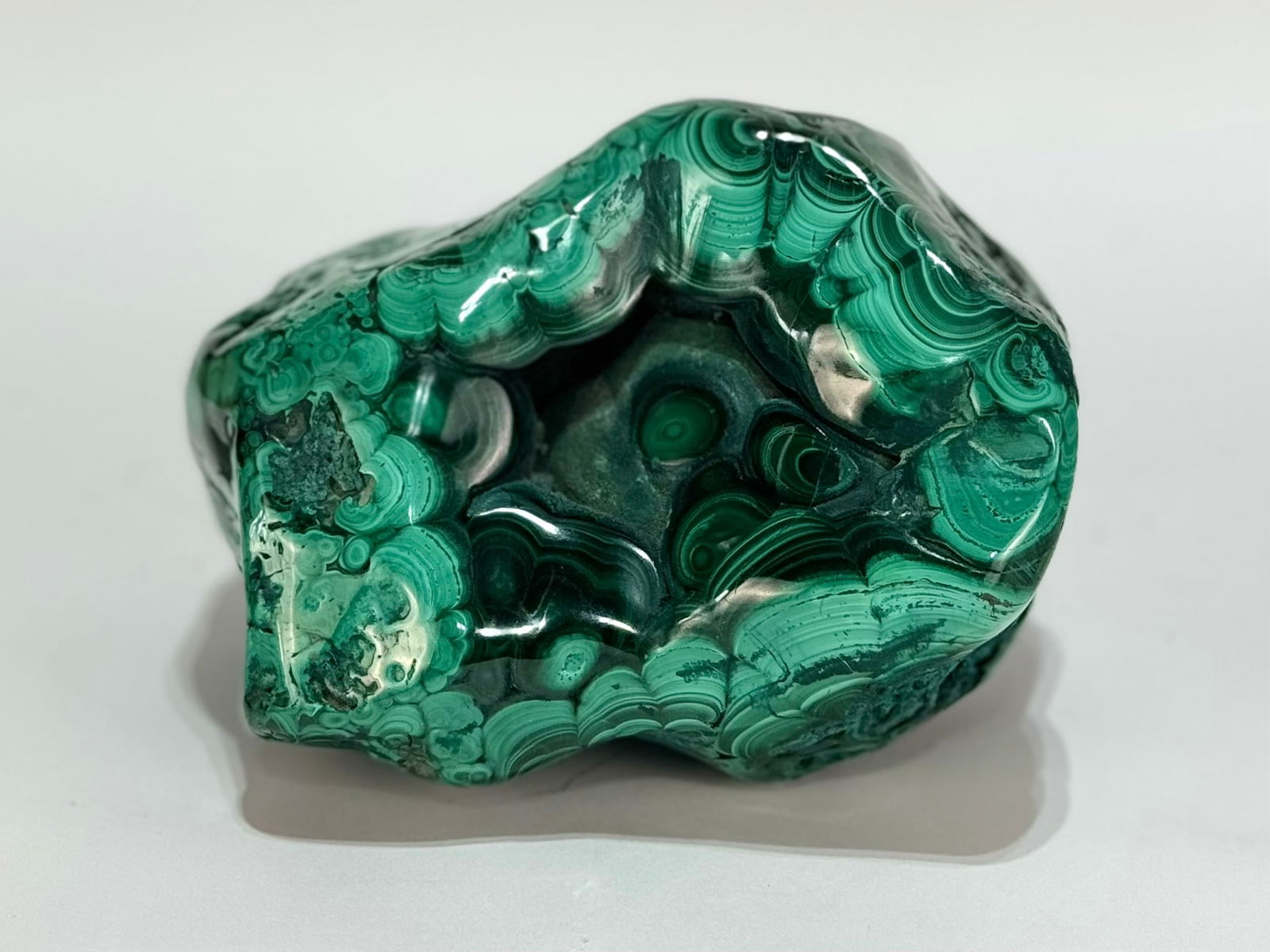 Polished Malachite Formation: Polished malachite formation from the DR Congo. 4.5” x 6” x 4”. 4 pounds, 15 ounces.