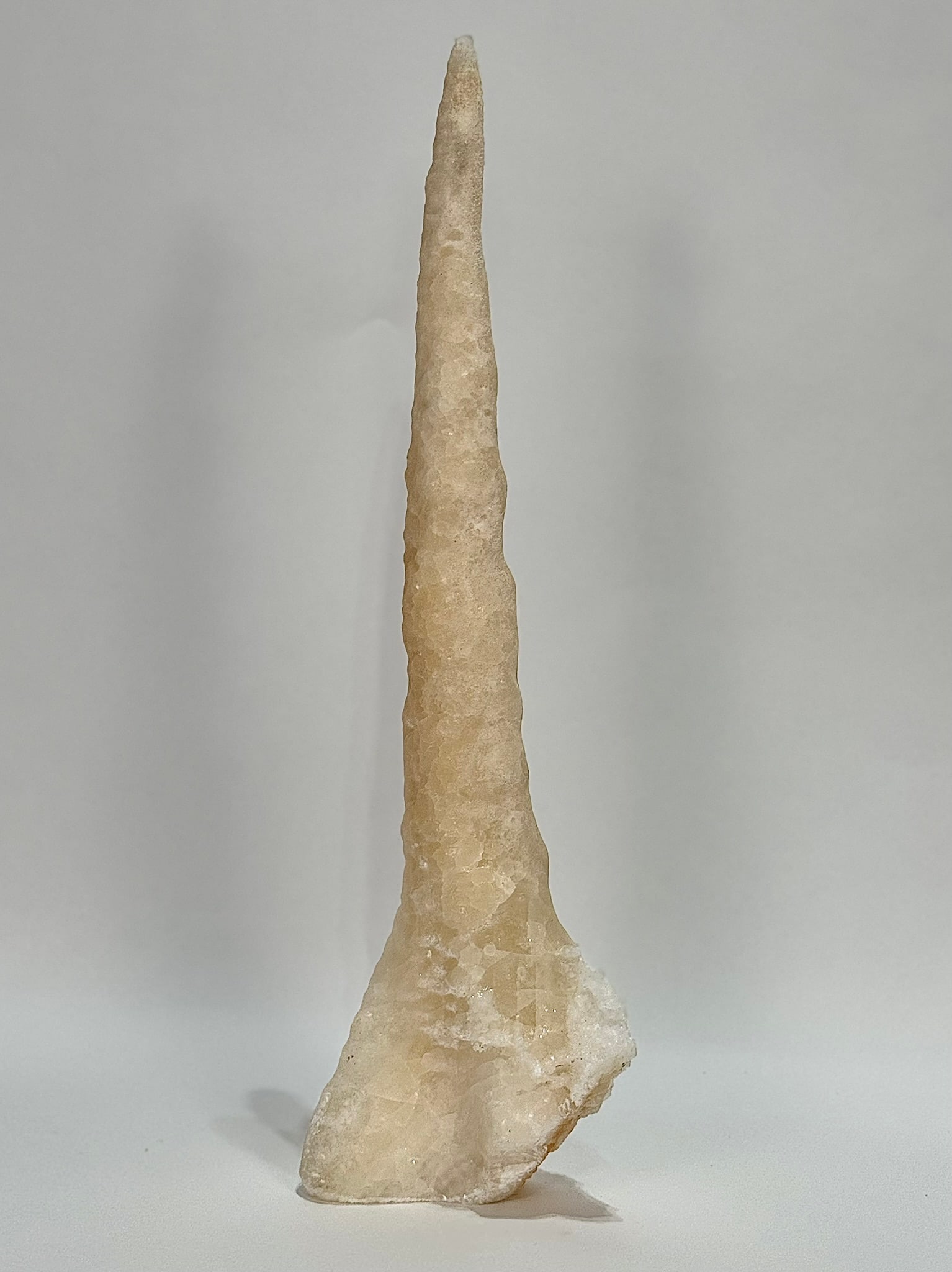 Remarkable Calcite Stalactite: Remarkable, freestanding calcite stalactite from China. 18.5" x 2.5" x 5.5". 4 lbs, 9 oz.