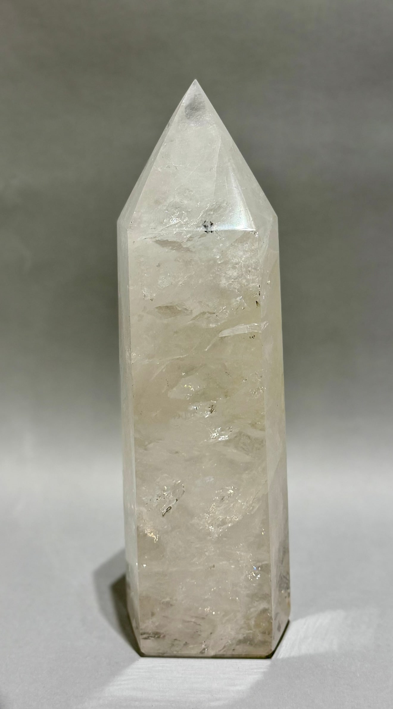Clear Quartz Crystal Obelisk With Inclusions: Clear quartz crystal obelisk with refractive inclusions from Brazil. 13” x 4” x 3.25”. 11 lbs, 3 oz.