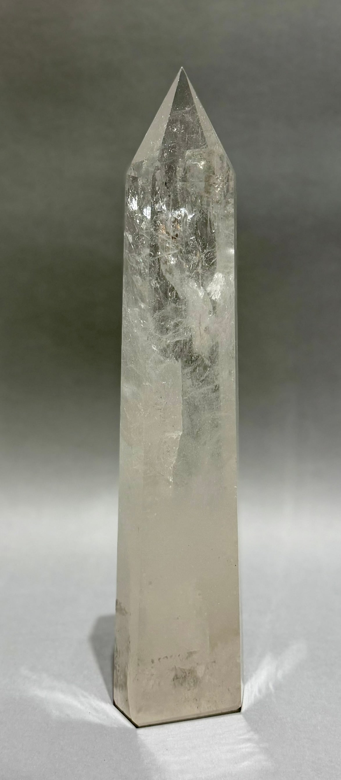 Clear Quartz Crystal Obelisk With Inclusions: Clear quartz crystal obelisk with refractive inclusions from Brazil. 13.5 x 3” x 2”. 4 lbs, 14 oz.