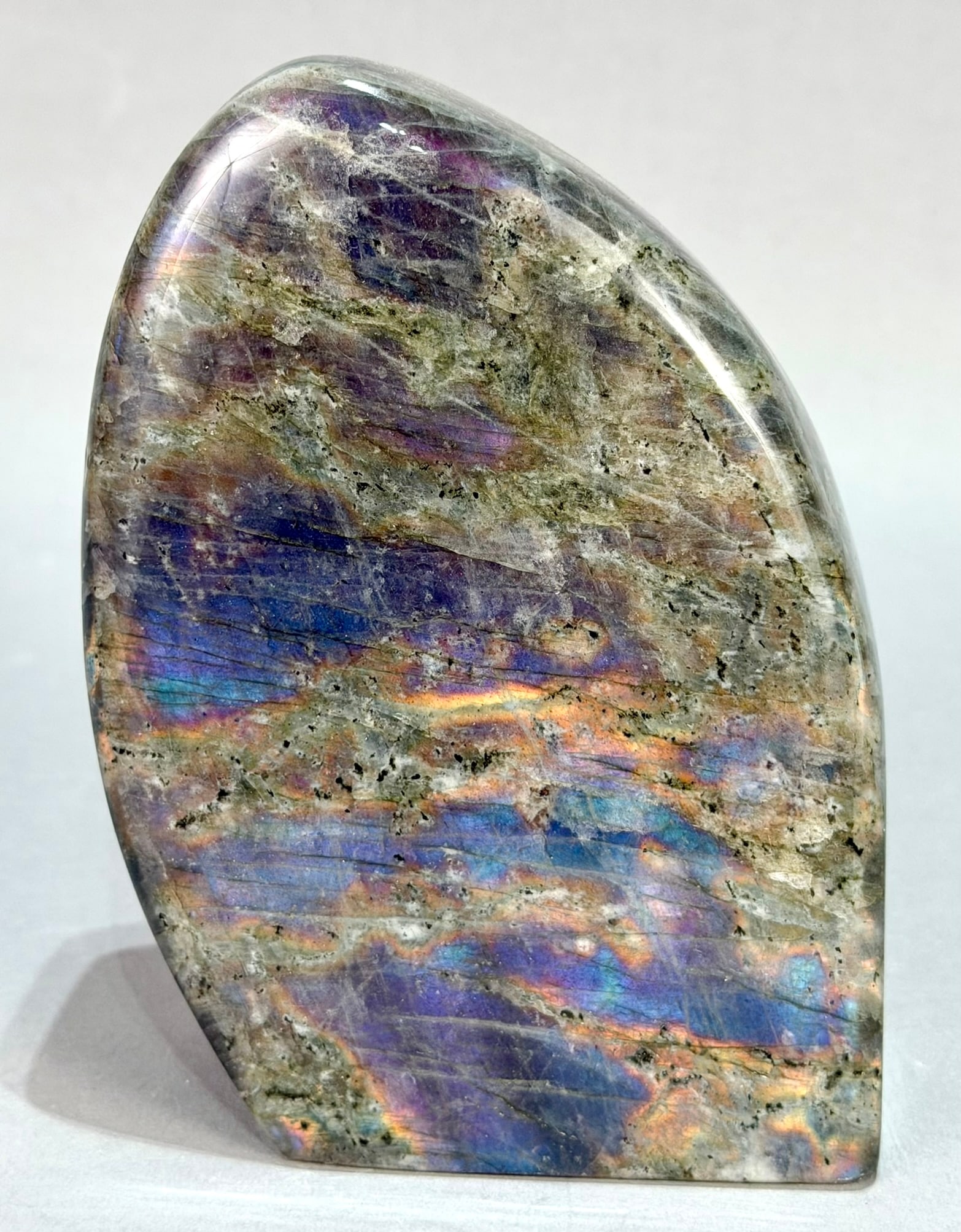Polished Pink/Purple Labradorite Freeform: Rare polished pink/purple labradorite freeform from Madagascar. 5.25" x 4" x 2". 3 pounds, 5 ounces.