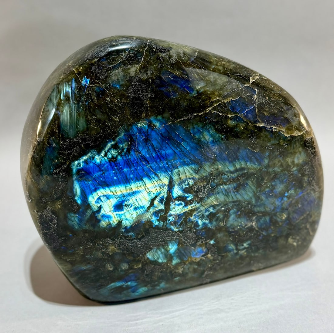 Large Polished Labradorite Freeform: Large polished labradorite freeform from Madagascar. 9" x 9.5” x 3.75". 22 pounds, 8 ounces.