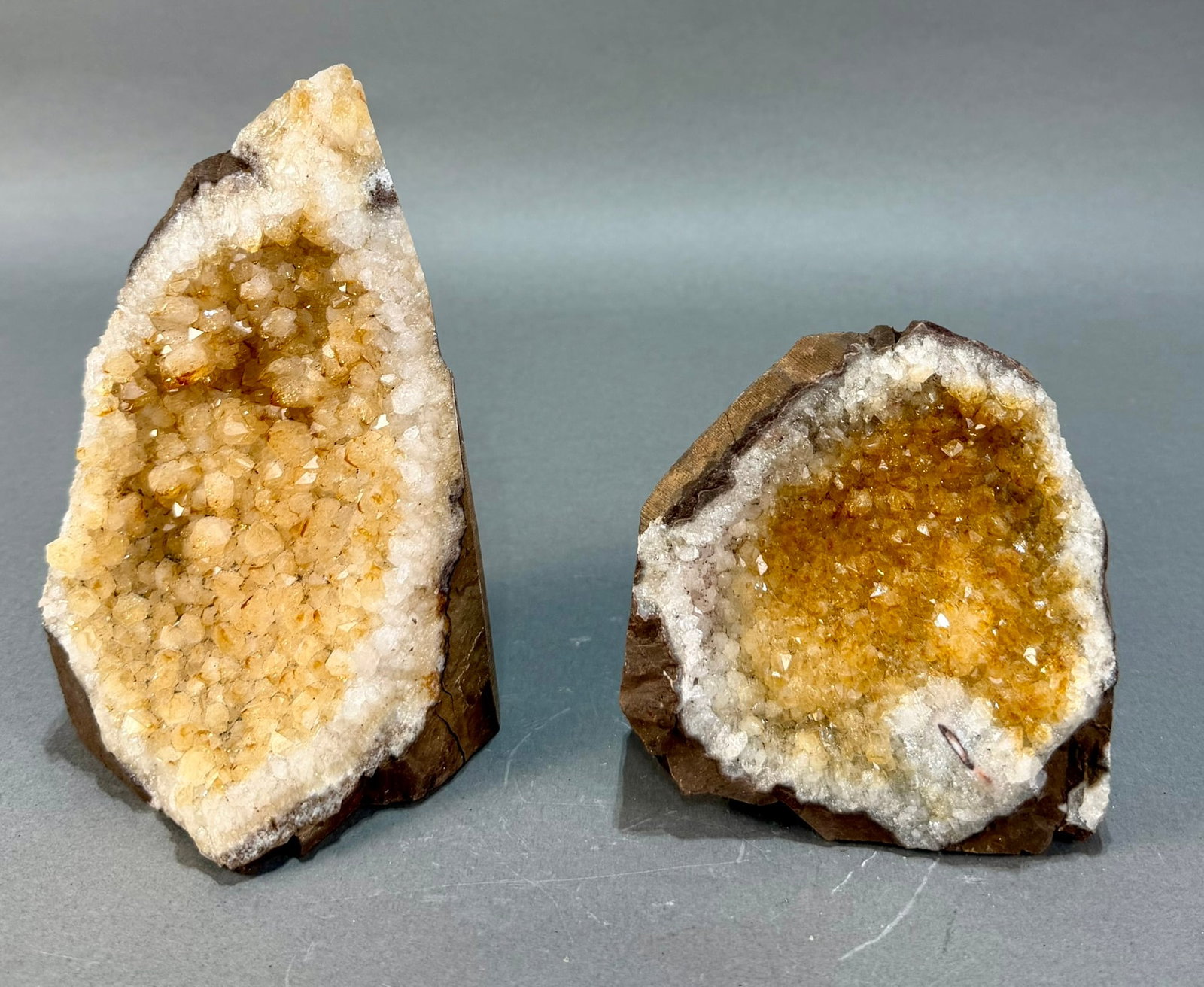 Two Small Citrine Geodes: Two small citrine geodes from Brazil. 6.5" and 4.5" high. 4 pounds, 7 ounces total.