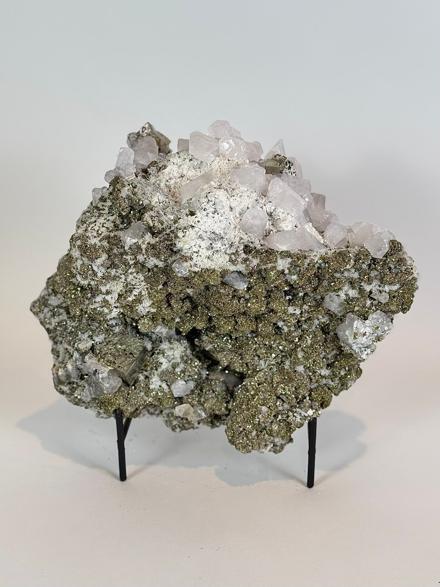 Cubic Pyrite, Chalcopyrite and Fluorescent Calcite Specimen: Cubic pyrite, chalcopyrite and highly fluorescent calcite formation from the Huanzala Mine in Ancash, Peru. 8" x 9" x 5". 11 lbs, 12 oz.