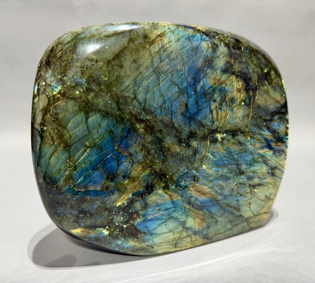 Large Polished Labradorite Freeform: Large polished labradorite freeform from Madagascar. 8" x 9.75” x 3.25". 17 lb, 14 ounces.
