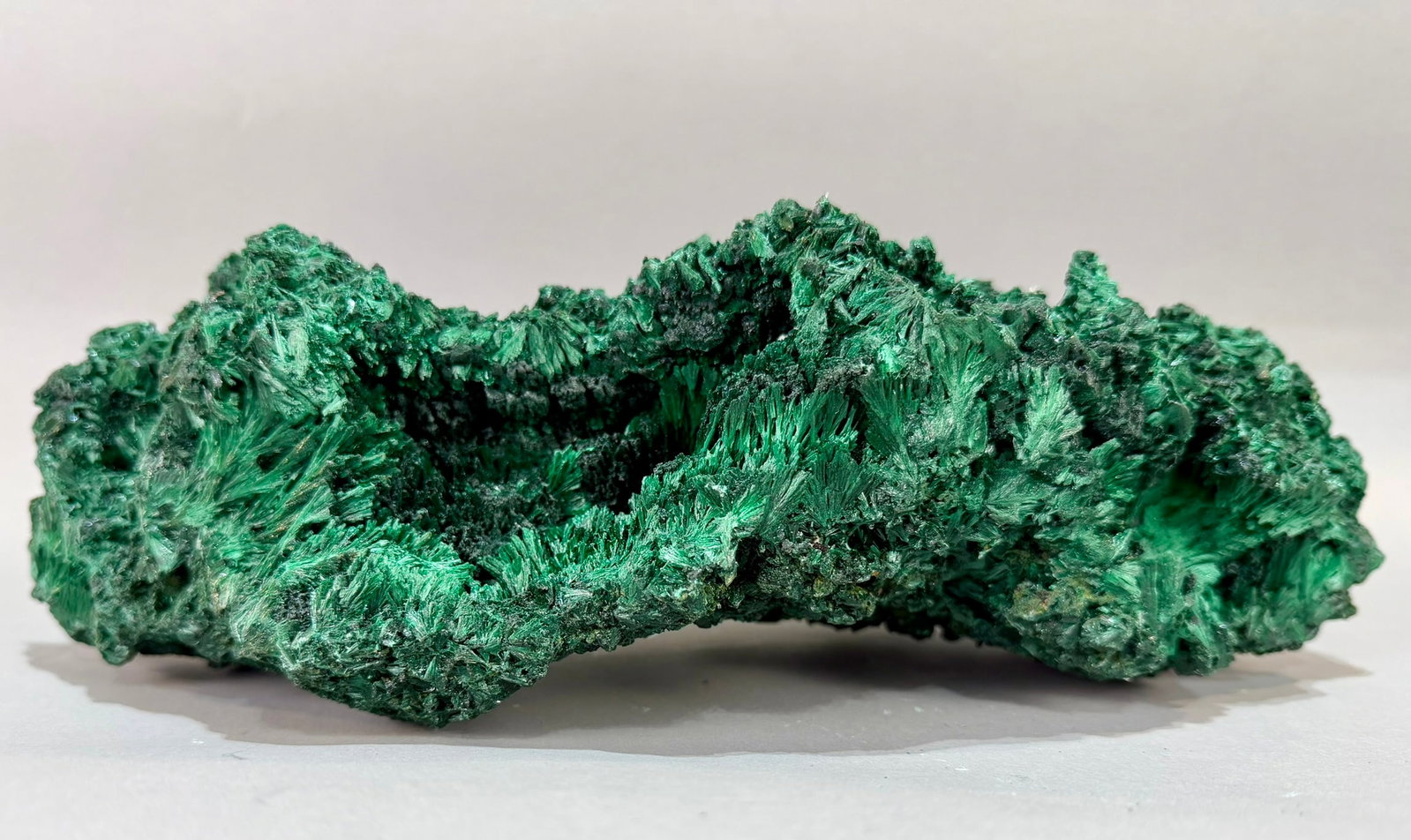 Large Fibrous Malachite Formation: Large, top-quality, fibrous malachite formation from the DR Congo. 8" x 14.5" x 4.75". 13 lb, 3 ounces.