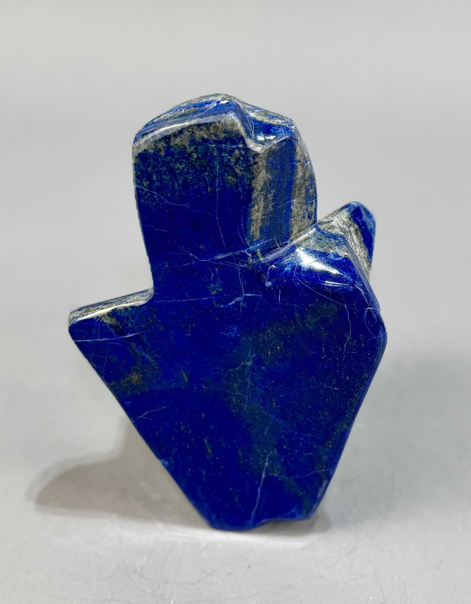 Polished Lapis Lazuli Freeform: High grade, finely polished lapis lazuli freeform from Afghanistan. 6.75” x 4.5” x 3.5”. 3 lbs, 14 oz.