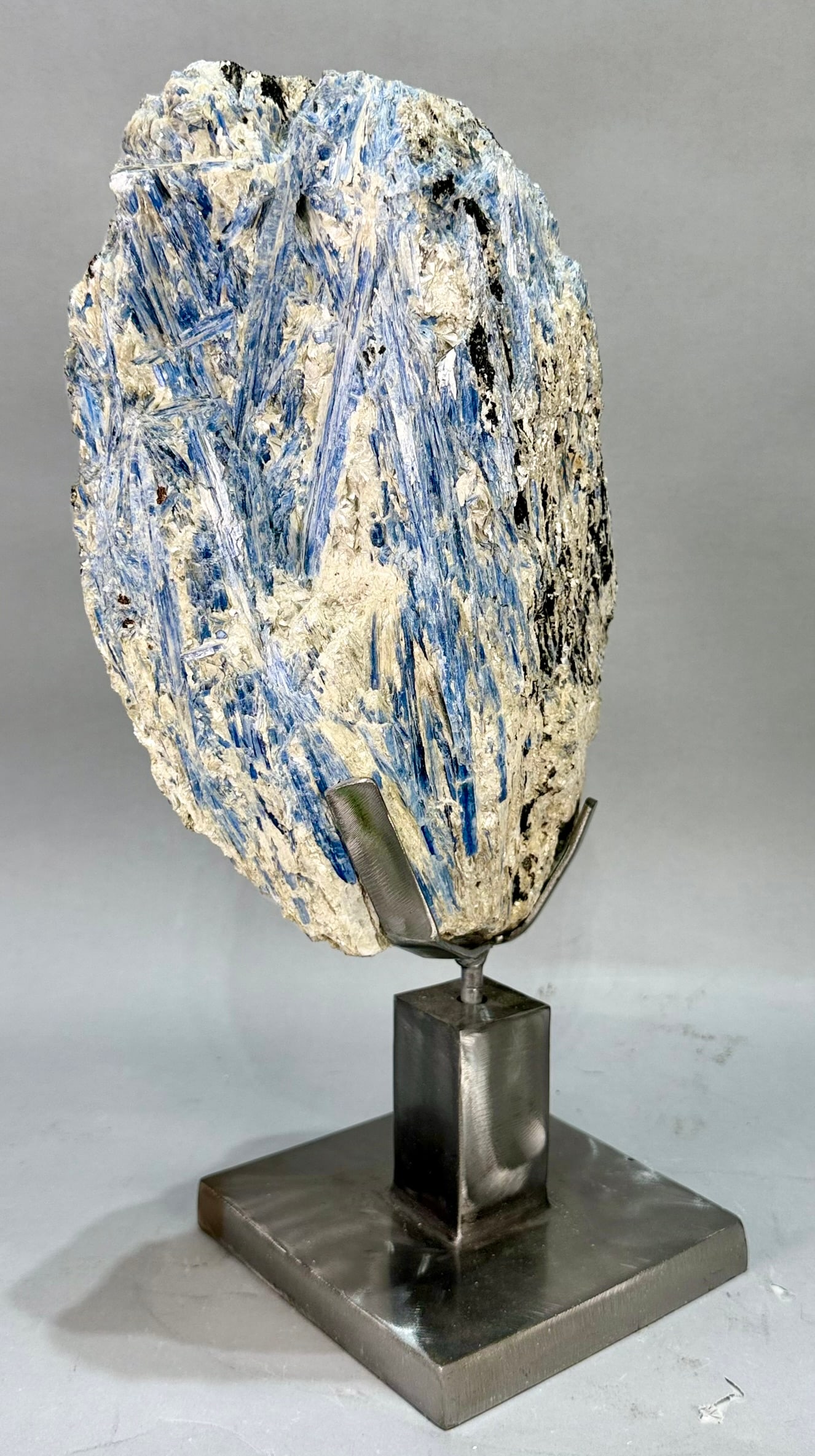Massive Kyanite and Quartz Formation on Spinning Stand: Massive kyanite, quartz and staurolite specimen from Brazil on custom spinning steel stand. 19" x 9" x 6.5". 40 lb, 8 ounces.