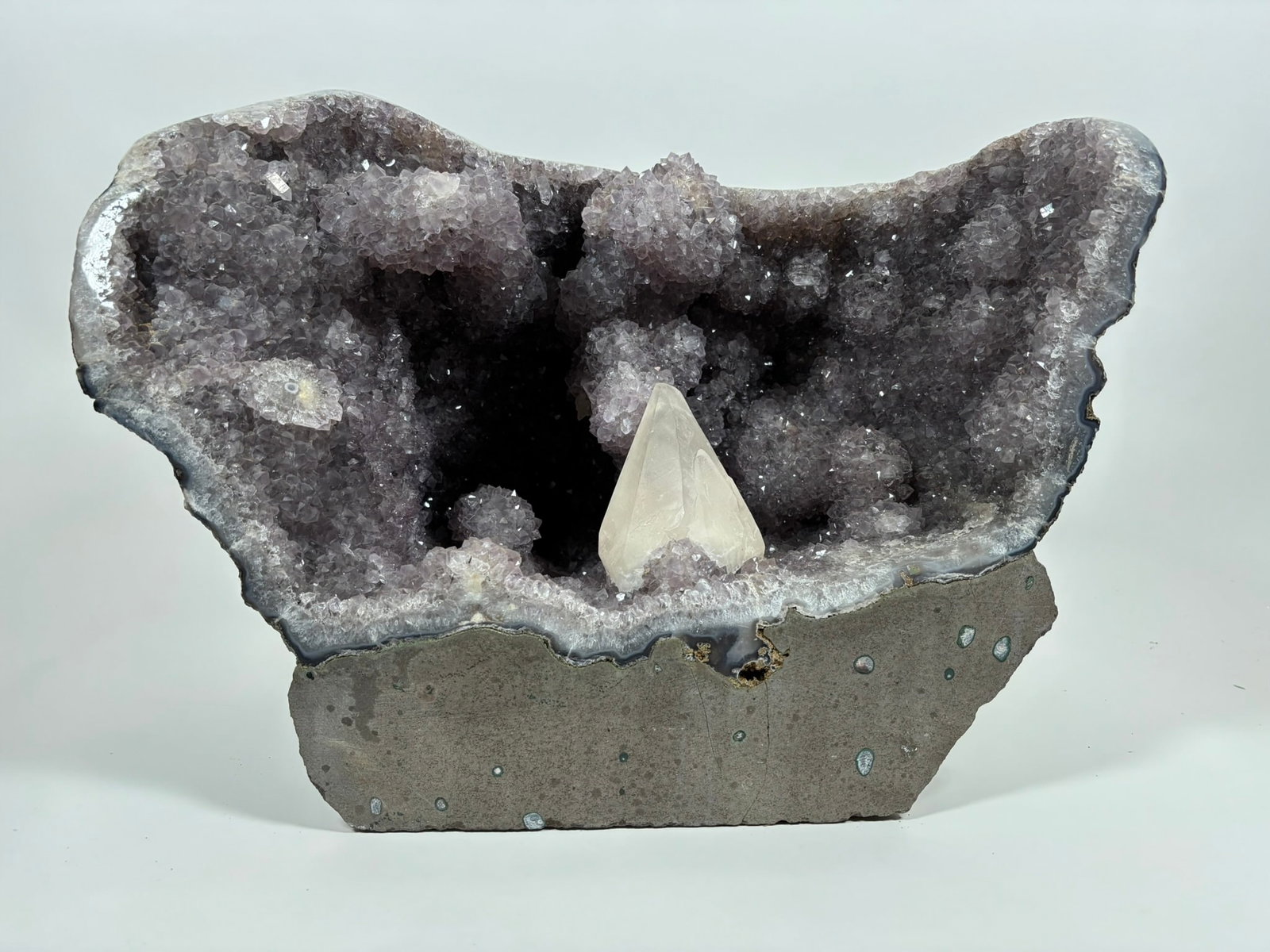 Large Amethyst Geode With Stalactites and Large Calcite Crystal: Large amethyst geode with stalactites and large calcite crystal from Brazil. 20" x 18" x 9". 72.85 lb.