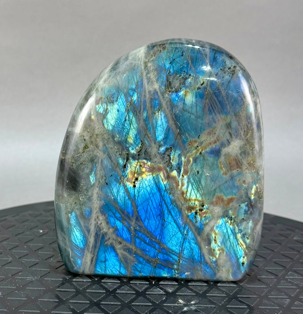 Labradorite Freeform: Polished labradorite freeform from Madagascar. 5.25" x 4.5" x 1.5". 2 lb, 7 ounces.