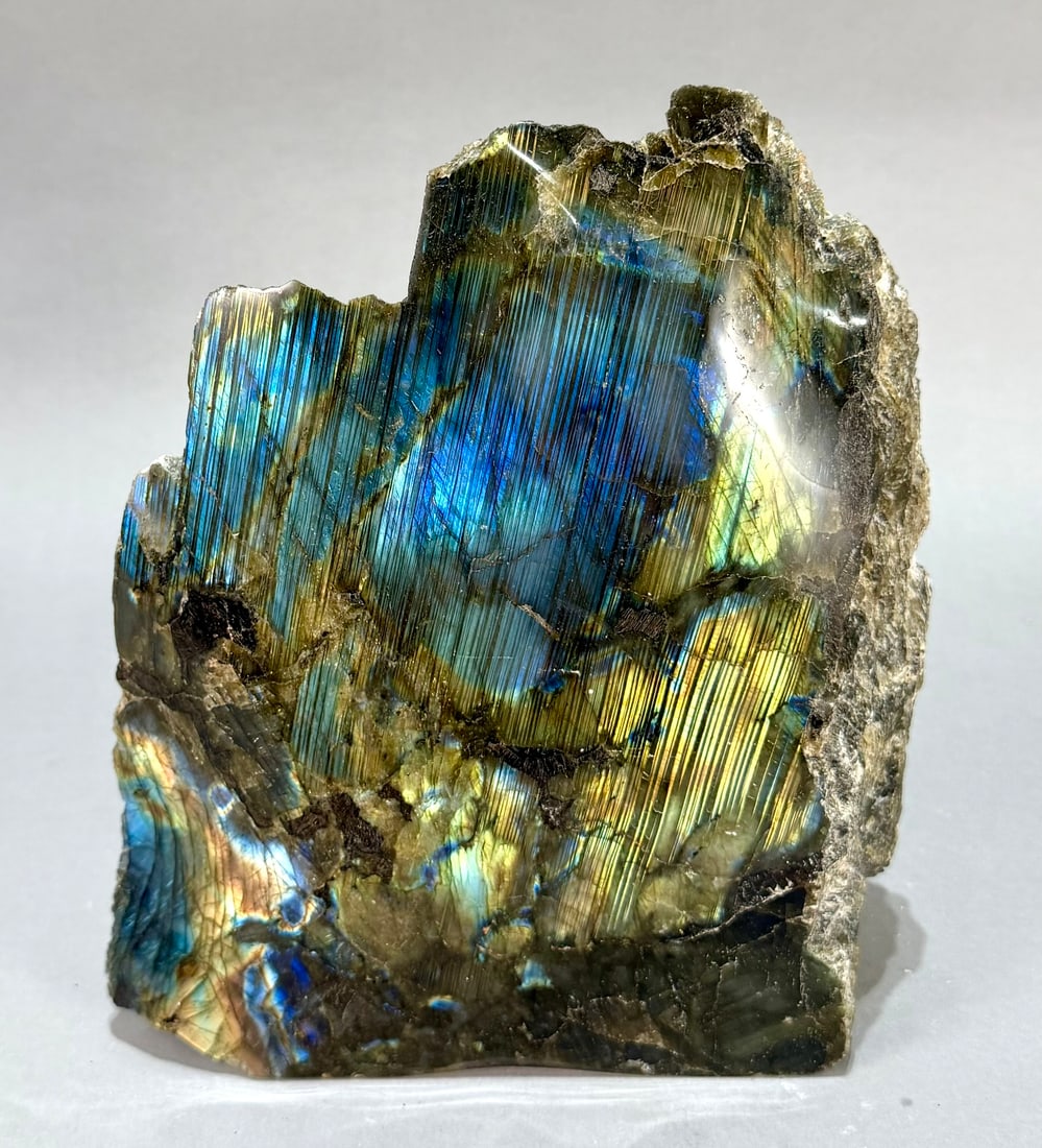 Live Edge Labradorite Freeform: Large, live edge, front-polished labradorite freeform from Madagascar. 9" x 8” x 2.75". 11 lb, 15 ounces.
