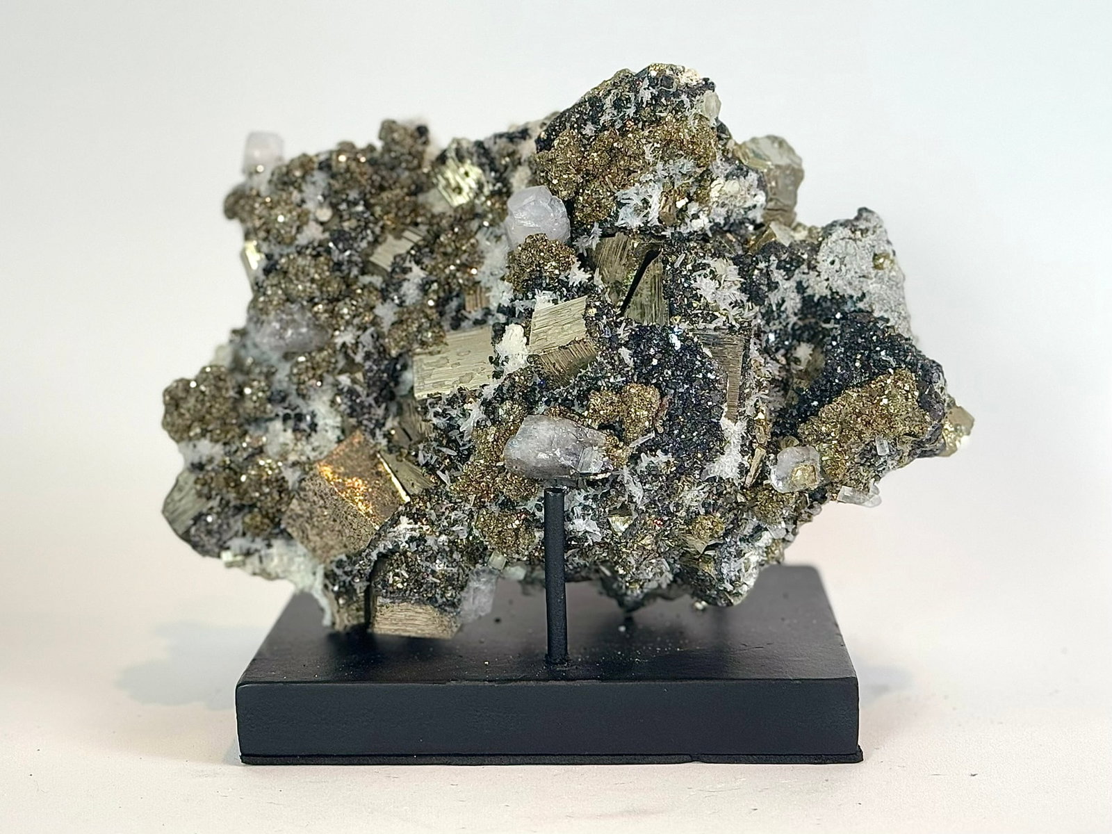 Cubic Pyrite, Calcite and Sphalerite Specimen: Cubic pyrite, fluorescent calcite and sphalerite formation from the Huanzala Mine in Ancash, Peru. 5.5" x 8.5" x 5.5". 8 lbs, 2 oz.