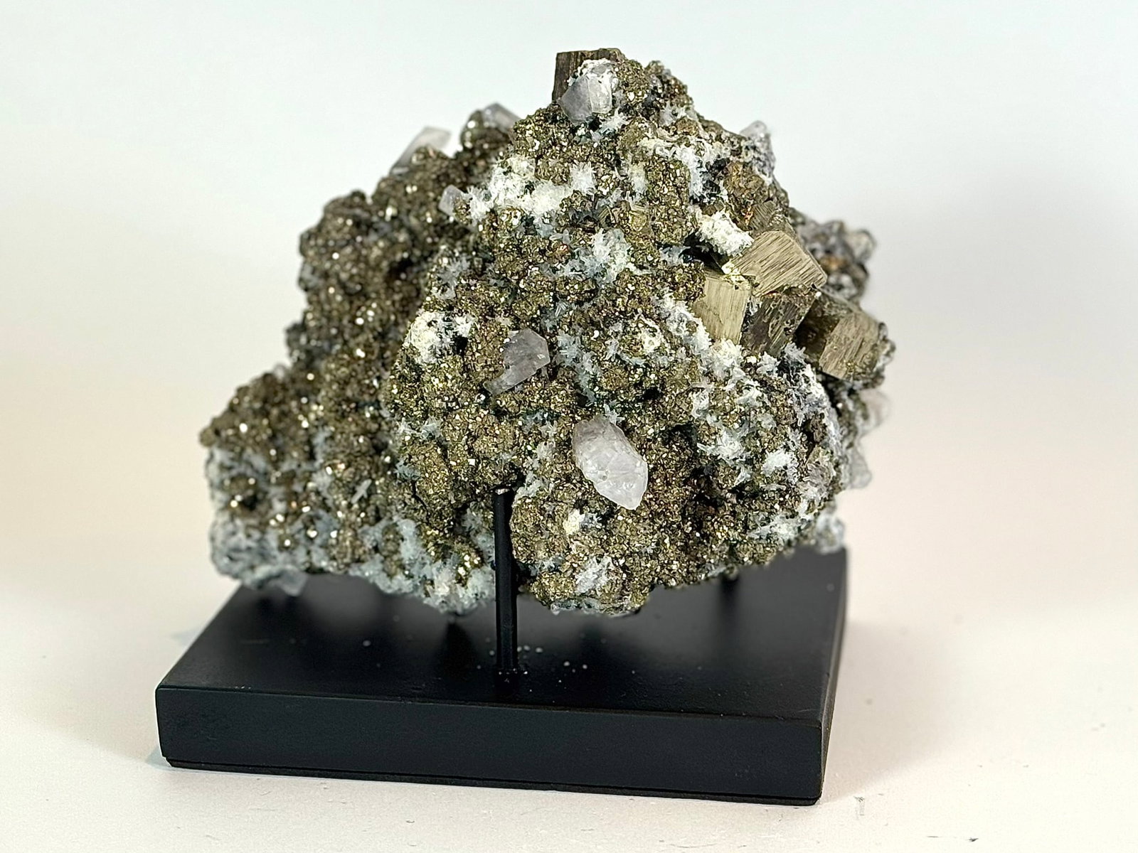 Cubic Pyrite, Chalcopyrite and Calcite Specimen: Cubic pyrite, chalcopyrite and fluorescent calcite formation from the Huanzala Mine in Ancash, Peru. 5.5" x 7" x 5". 4 lbs, 12 oz.