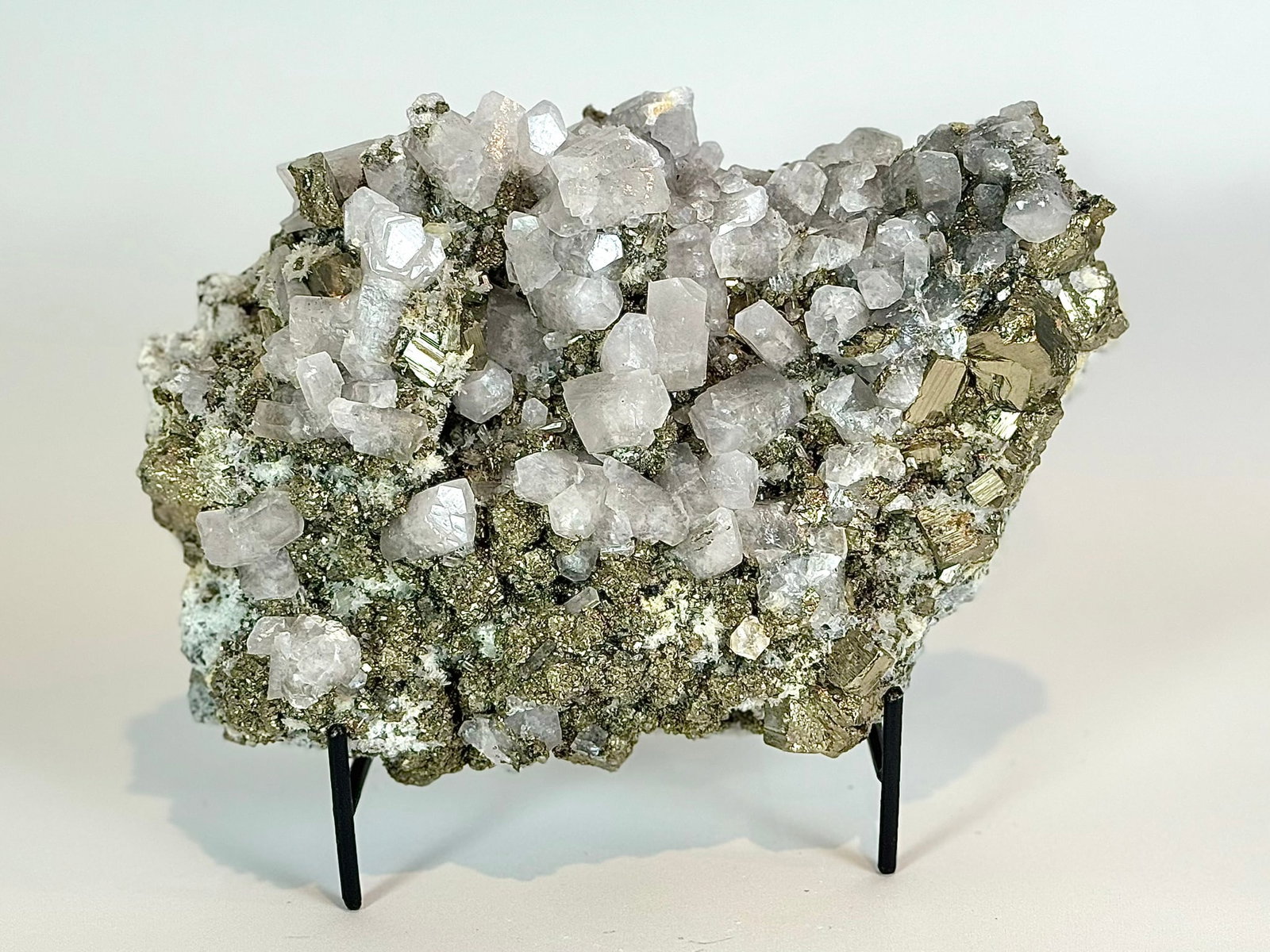 Cubic Pyrite, Chalcopyrite and Fluorescent Calcite Specimen: Cubic pyrite, chalcopyrite and highly fluorescent calcite formation from the Huanzala Mine in Ancash, Peru. 6" x 9" x 3.5". 7 lbs.