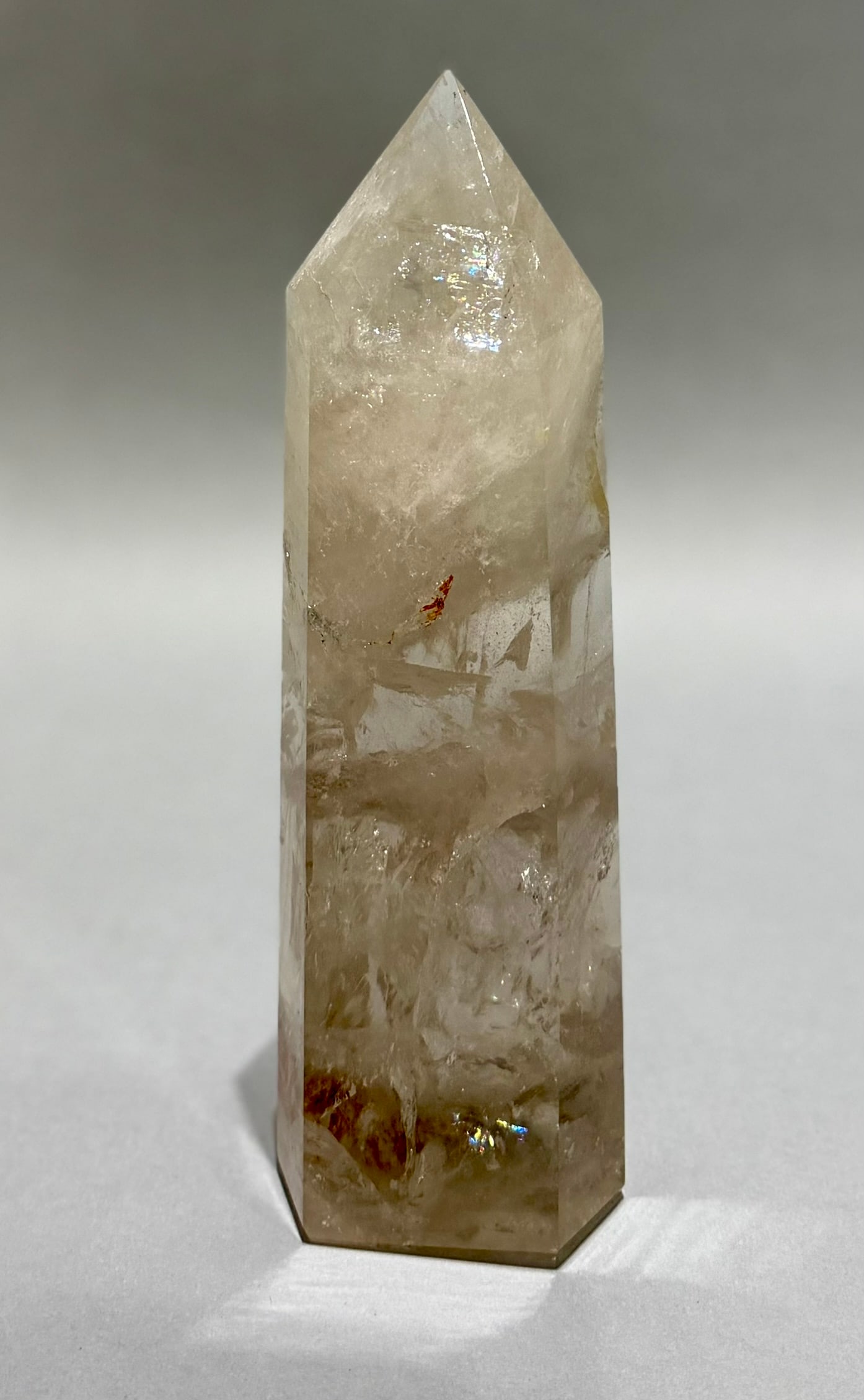 Clear Quartz Crystal Obelisk With Inclusions: Clear quartz crystal obelisk with refractive inclusions from Brazil. 9.5” x 3” x 1.75”. 3 lbs.