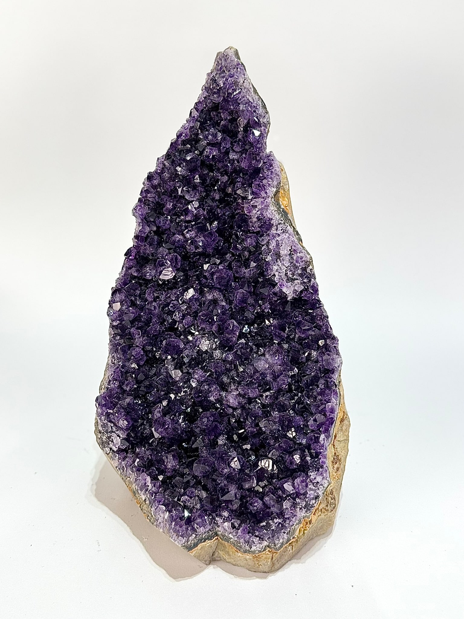 Uruguayan Amethyst Cluster: Dark purple freestanding Uruguayan amethyst cluster. 11" x 6.5" x 7". 13 lbs, 6 oz.
