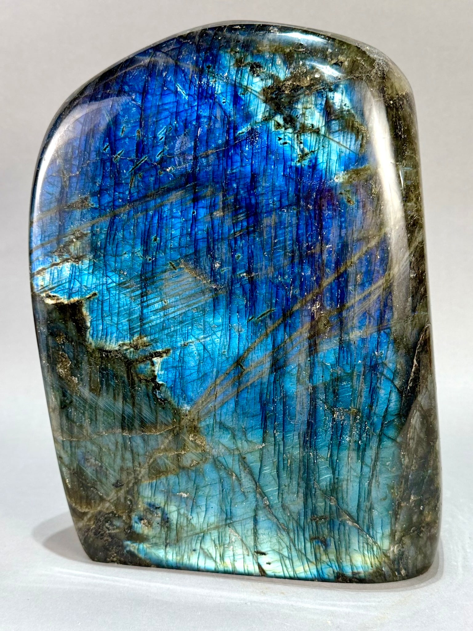 Large Polished Labradorite Freeform: Large polished labradorite freeform from Madagascar. 10" x 7.5” x 4". 21 lb, 8 ounces.