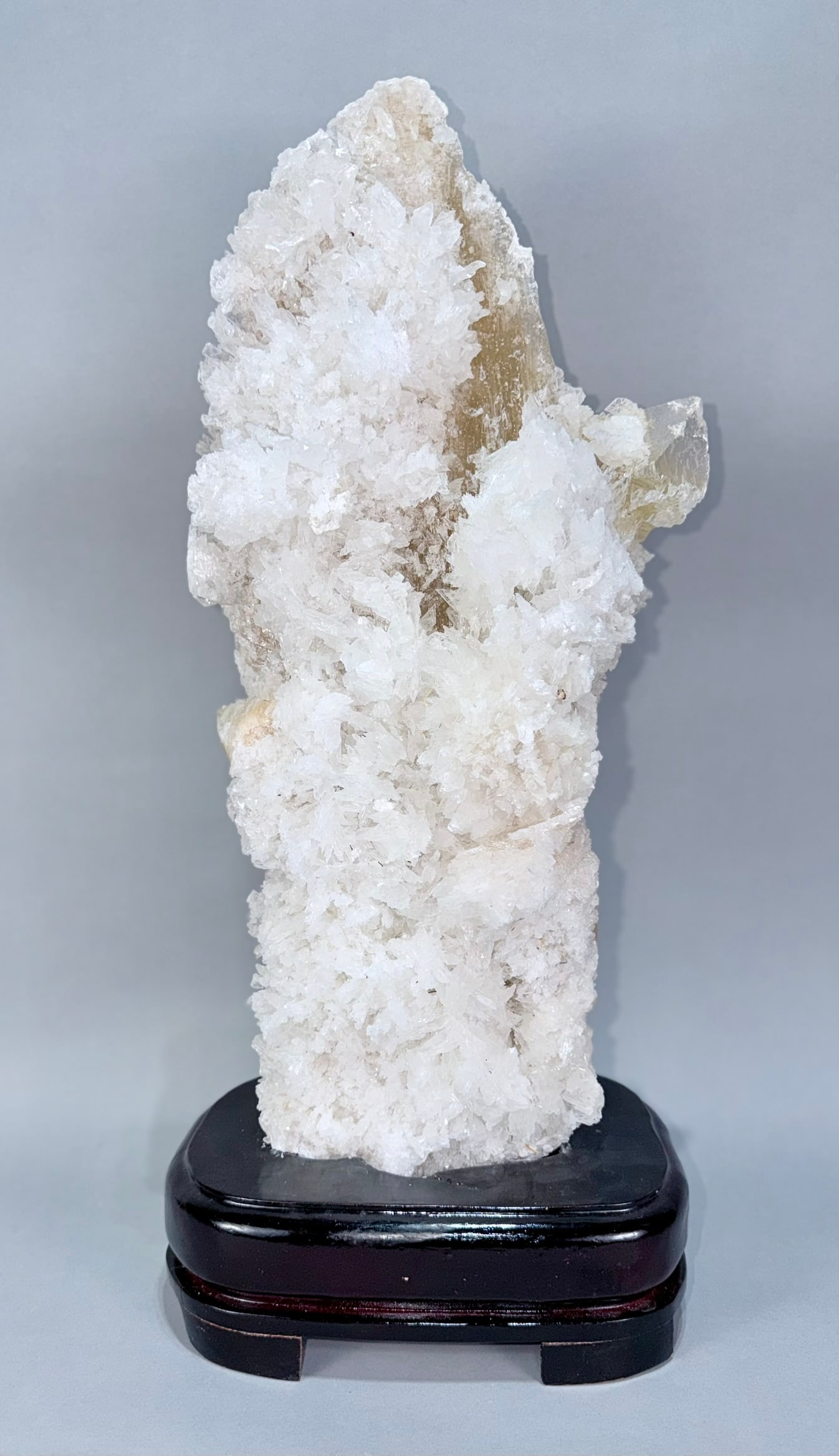 Yun Nan Calcite Stalactite Formation: Huge Yun Nan calcite stalactite formation on custom wood stand. This specimen was $3200 at a gem store. 23” x 10” x 7”. 27 lbs, 2 oz.