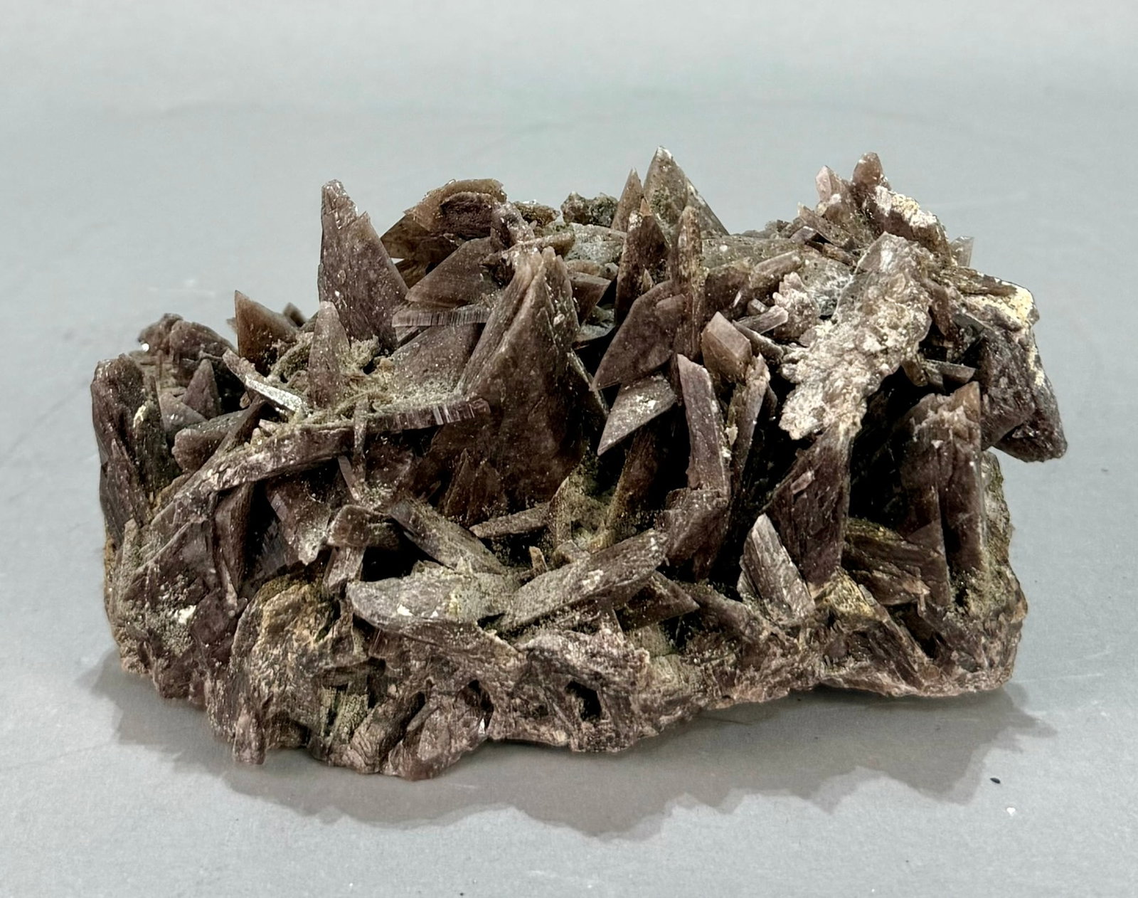 Rare Axinite Formation: Rare bladed axinite formation from Peru. 4.5" x 6.25" x 3.5". 2 lb, 15 ounces.