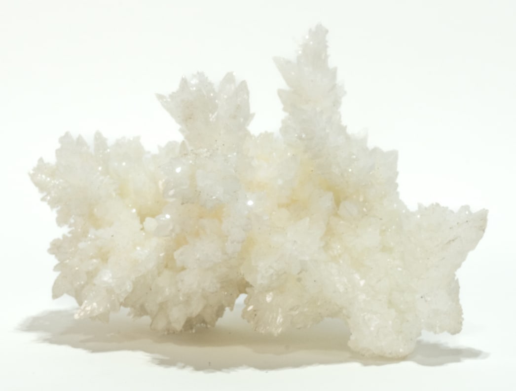 White Crystalline Aragonite Formation: Beautiful white crystalline aragonite formation from Chihuahua, Mexico. 6" x 9" x 7". 3 lbs, 10 oz.