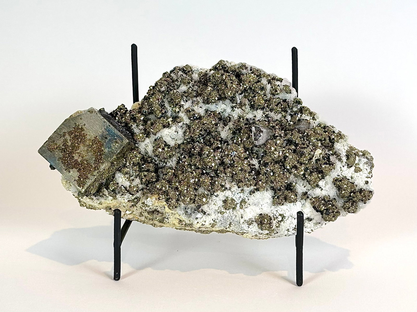 Cubic Pyrite, Chalcopyrite, Calcite and Sphalerite Specimen: Cubic pyrite, chalcopyrite, fluorescent calcite and sphalerite formation from the Huanzala Mine in Ancash, Peru. 5" x 9" x 4". 5 lbs, 6 oz.