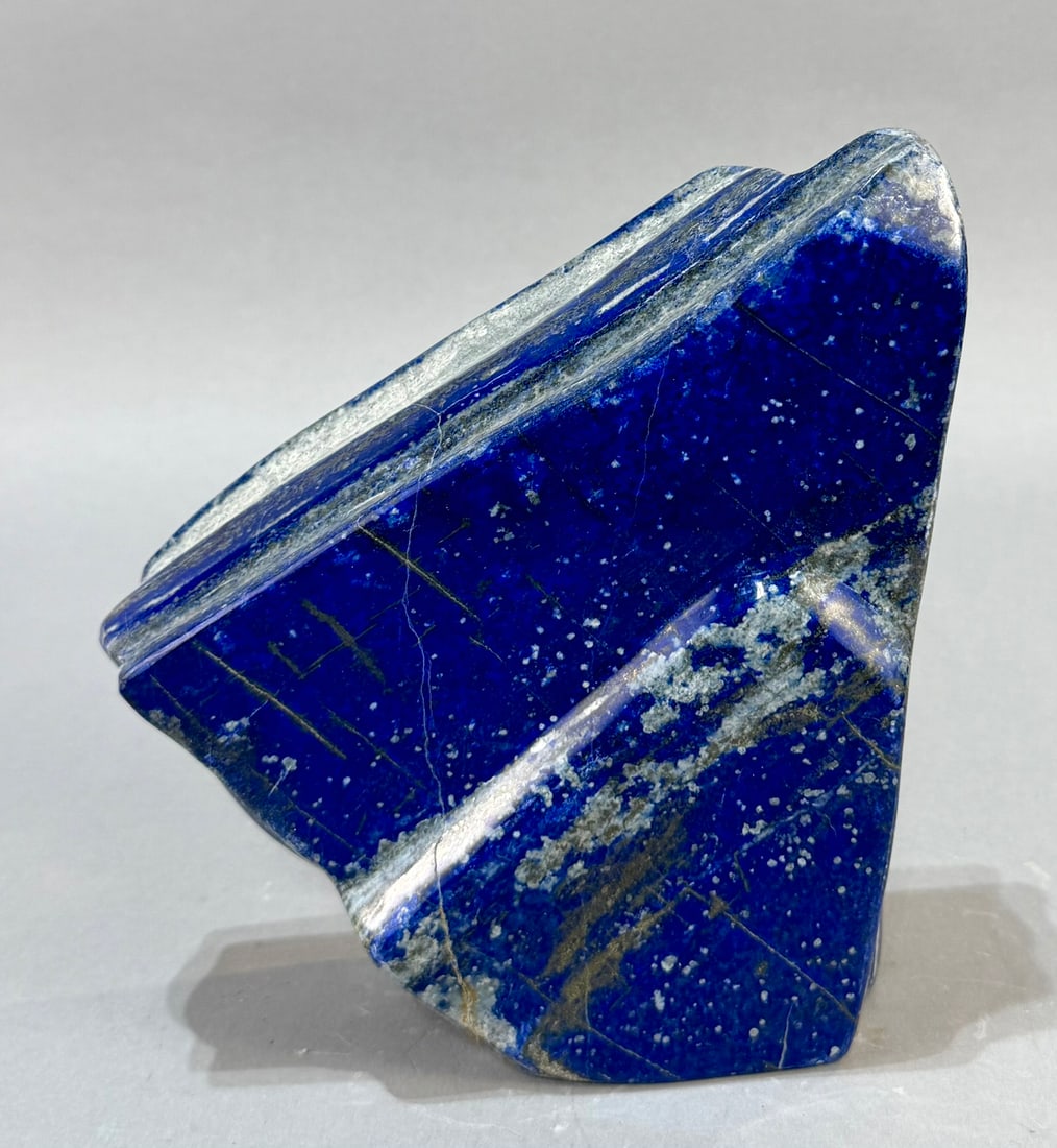 Polished Lapis Lazuli Freeform: High grade, finely polished lapis lazuli freeform from Afghanistan. 7" x 6.75" x 2.25". 7 lb, 3 ounces.