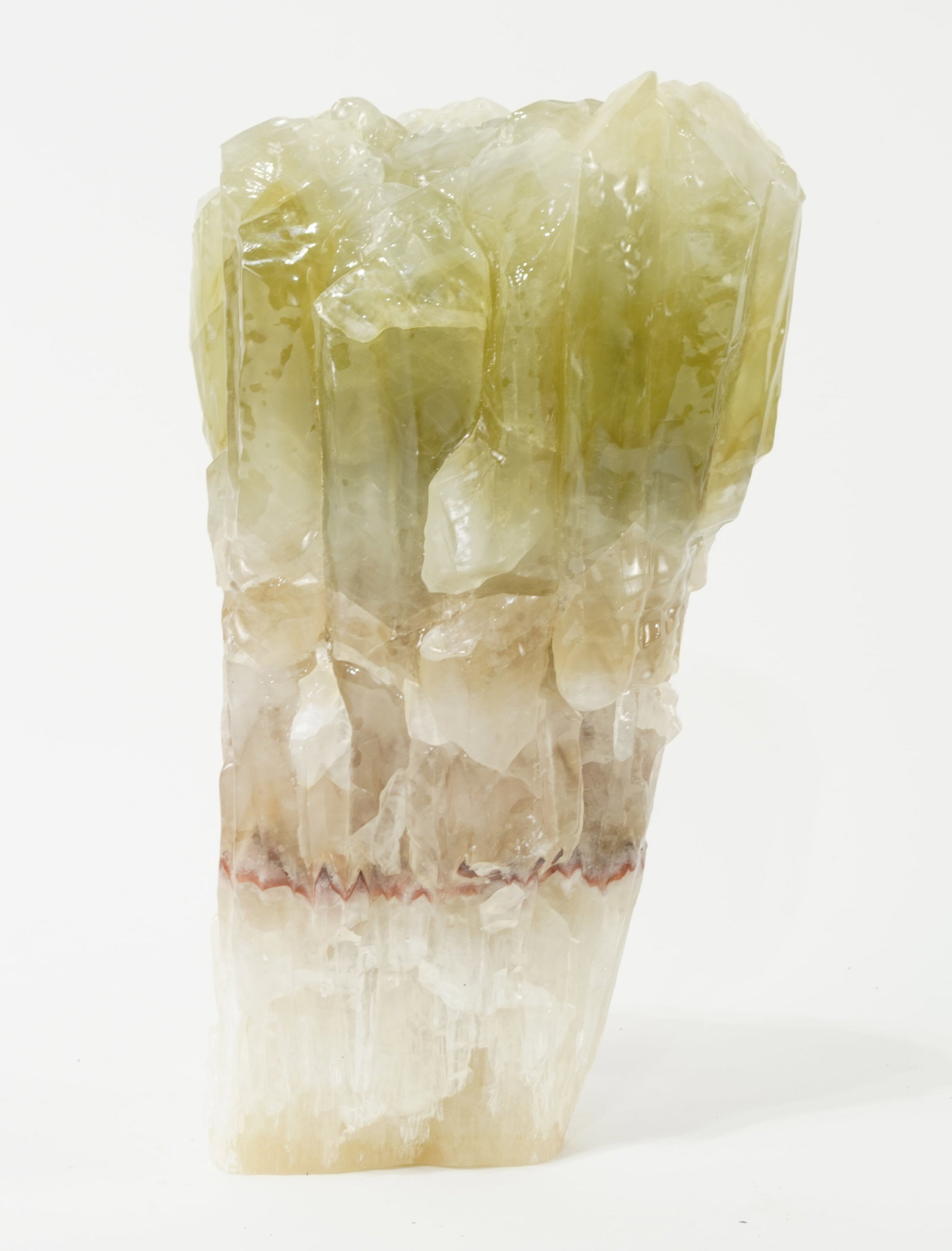 Green Calcite Formation: Green, red and brown calcite formation from Durango, Mexico. 9" x 4" x 3.5". 7.11 lbs.