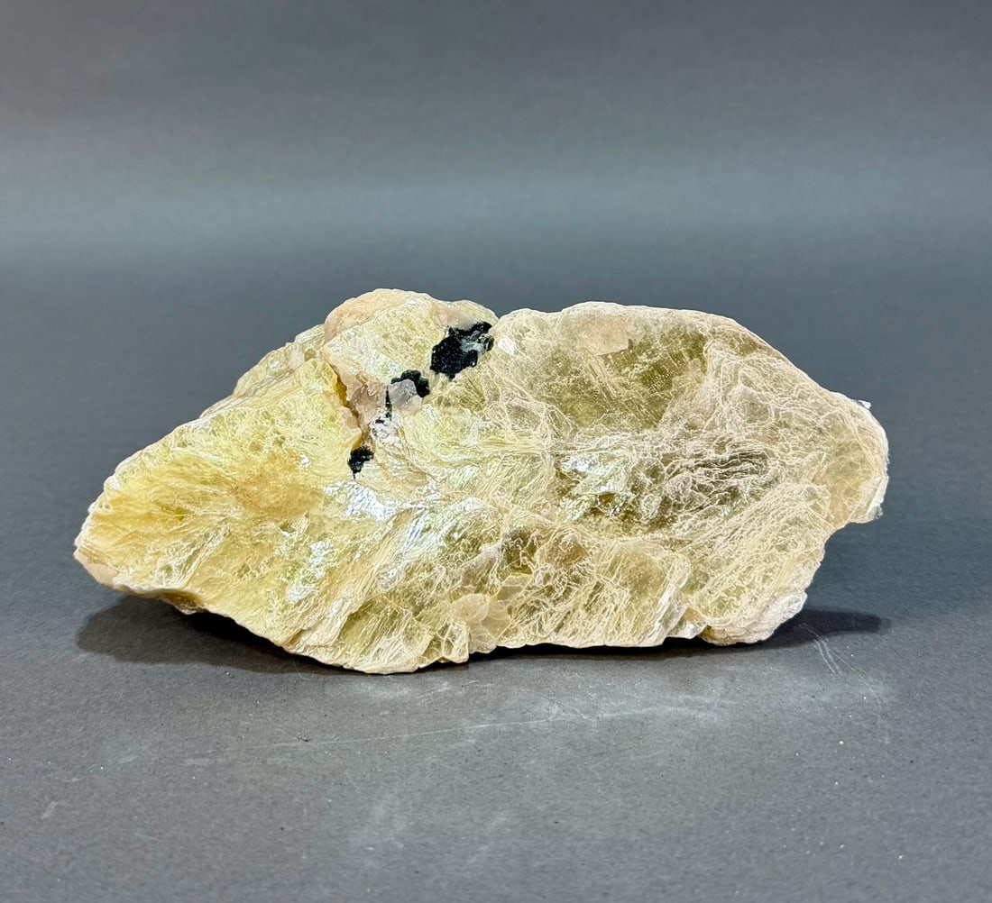 Golden Muscovite Mica Specimen: Golden muscovite mica specimen. 6.25" x 3" x 3". 1 pound, 9 ounces.