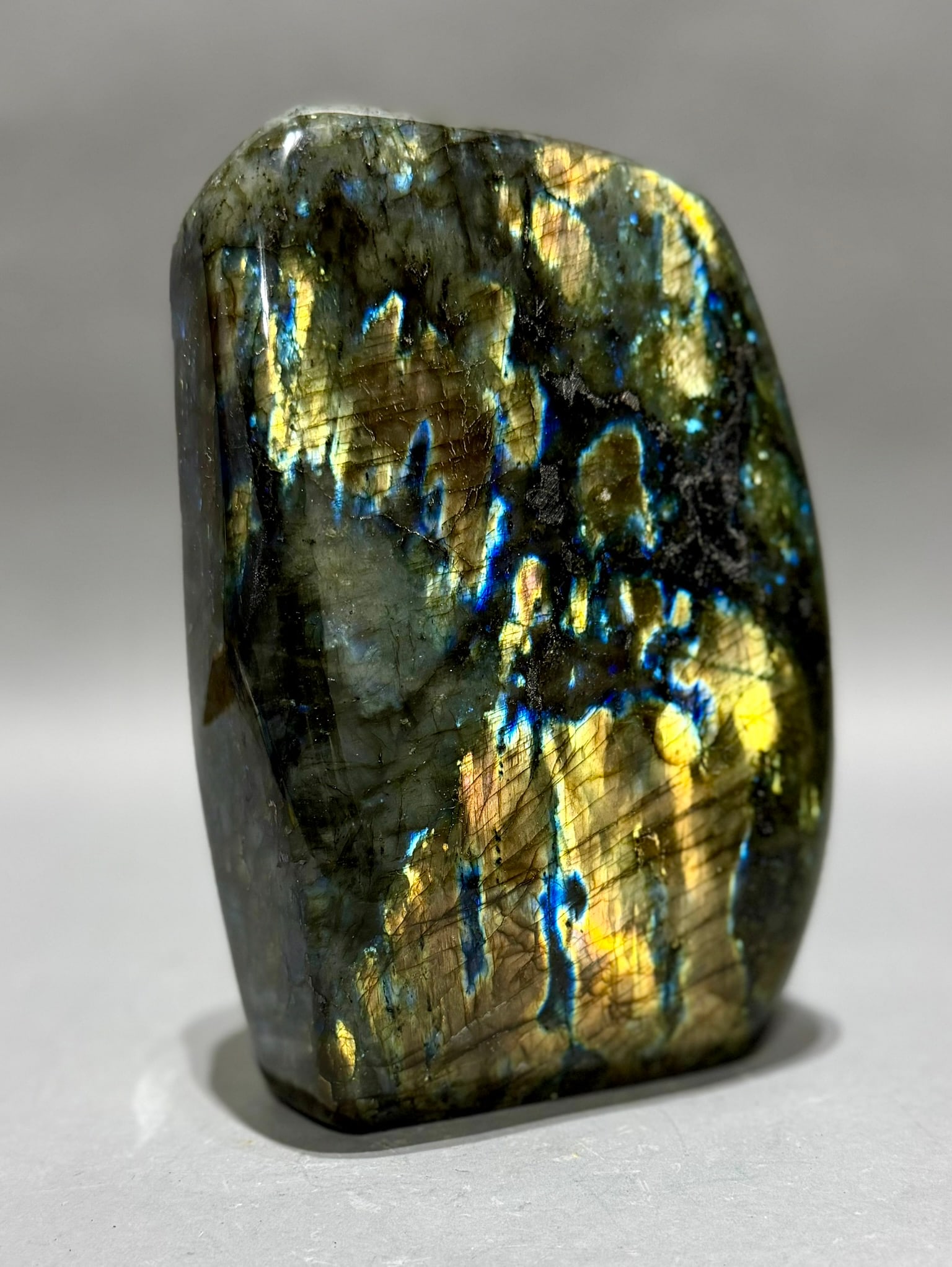 Large Polished Labradorite Freeform: Large polished labradorite freeform from Madagascar. 8.75" x 6” x 2.5". 9 lb, 12 ounces.