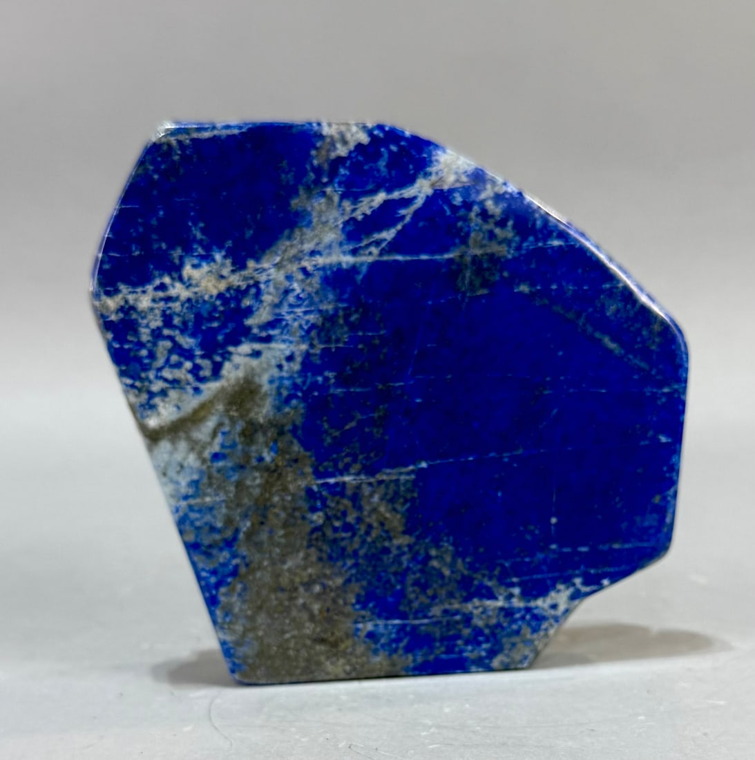 Polished Lapis Lazuli Freeform: High grade, finely polished lapis lazuli freeform from Afghanistan. 5.25" x 5.75" x 1.25". 2 lb, 14 ounces.
