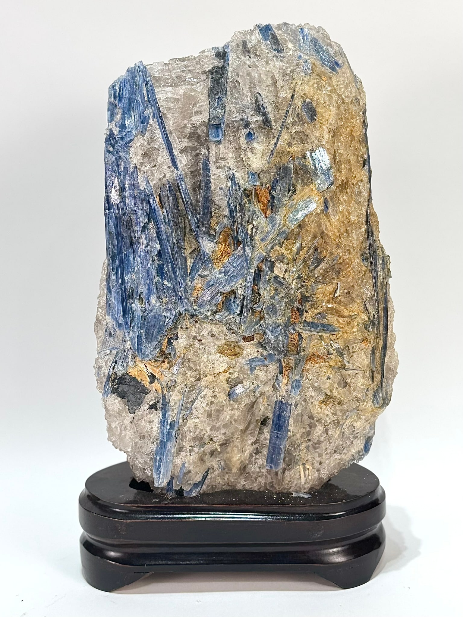 Kyanite and Quartz Formation on Wood Stand: Kyanite and quartz formation from Brazil on wood stand. 12.5” x 7.25" x 4”. 12 lbs, 15 oz.