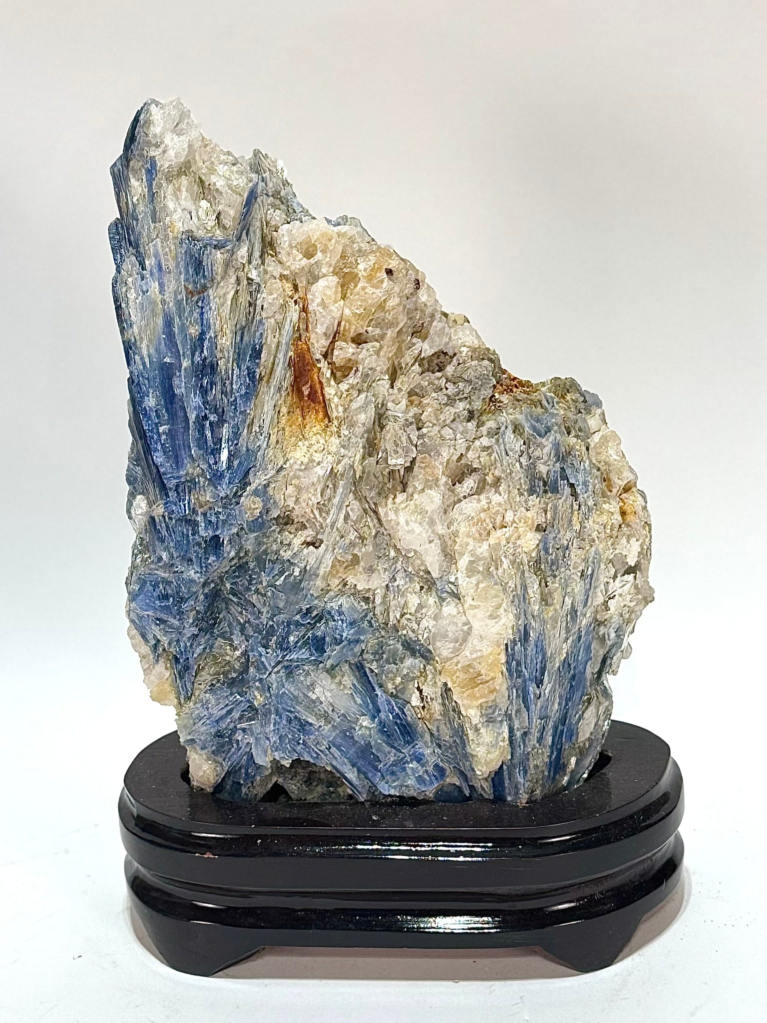 Kyanite and Quartz Formation on Wood Stand: Kyanite and quartz formation on wood stand from Brazil. 10” x 7” x 3.5". 7 lbs, 3 oz.