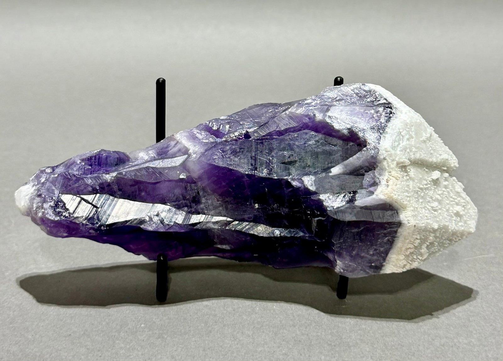 Atomic Amethyst Crystal Point: Super rare atomic amethyst crystal point from Santander, Colombia. Quartz over amethyst with internal starburst pattern. 6” x 2.5” x 2”. .86 pounds