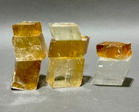 8 Optical Calcite Iceland Spar Rhomboid Formations: 8 optical calcite/iceland spar rhomboid formations. 1 pound, 9 ounces total.