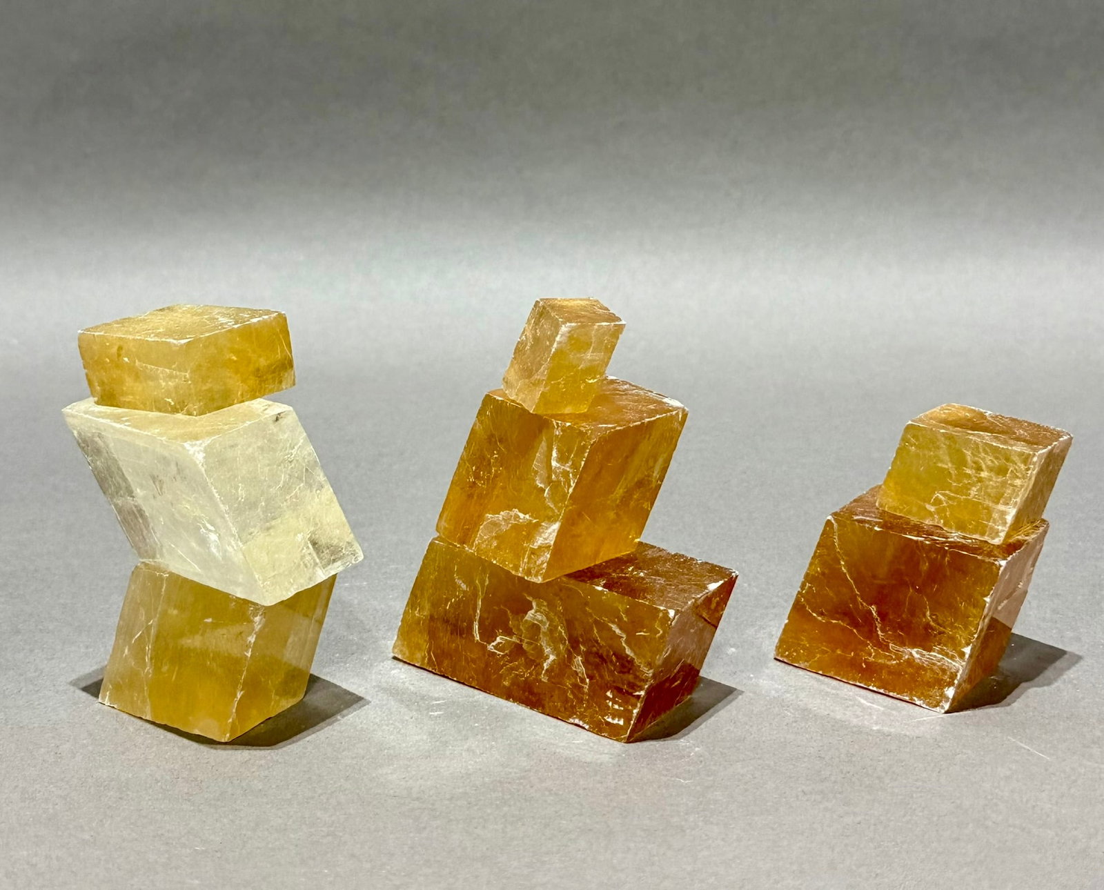 8 Optical Calcite Iceland Spar Rhomboid Formations: Group of 8 optical calcite/Iceland spar rhomboid formations. 1.28 pounds.