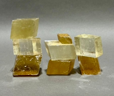 8 Optical Calcite Iceland Spar Rhomboid Formations: Group of 8 optical calcite/Iceland spar rhomboid formations. 1.24 pounds.