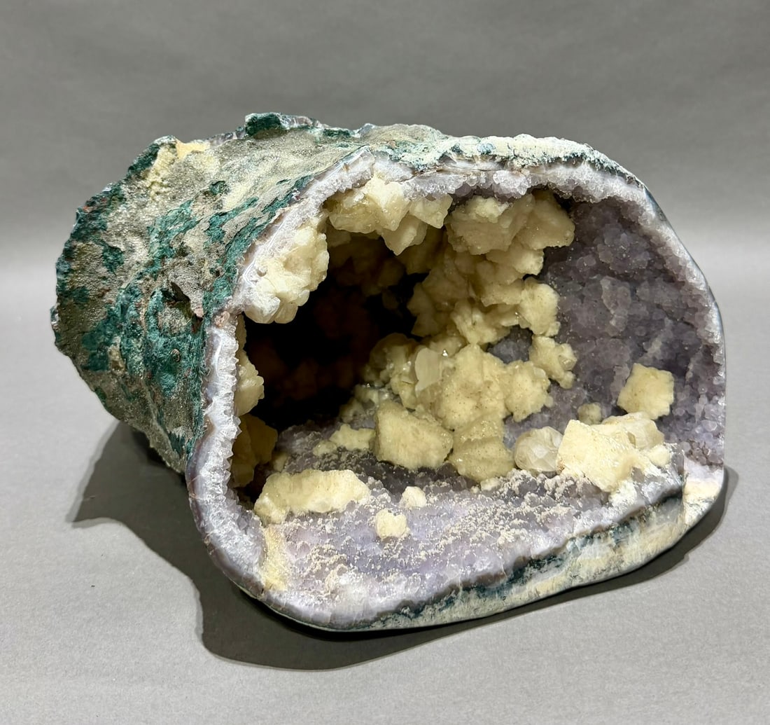 Amethyst Vug Geode wIth Fluorescent Calcite Crystals: Rare and unique amethyst vug geode with fluorescent calcite crystals. 7” x 10.5” x 13”. 20.6 pounds.