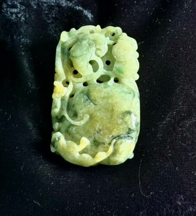 Large Carved Jade Pendant: Large carved jade pendant from China. 2.25" x 1.5" x .3". 50 grams.