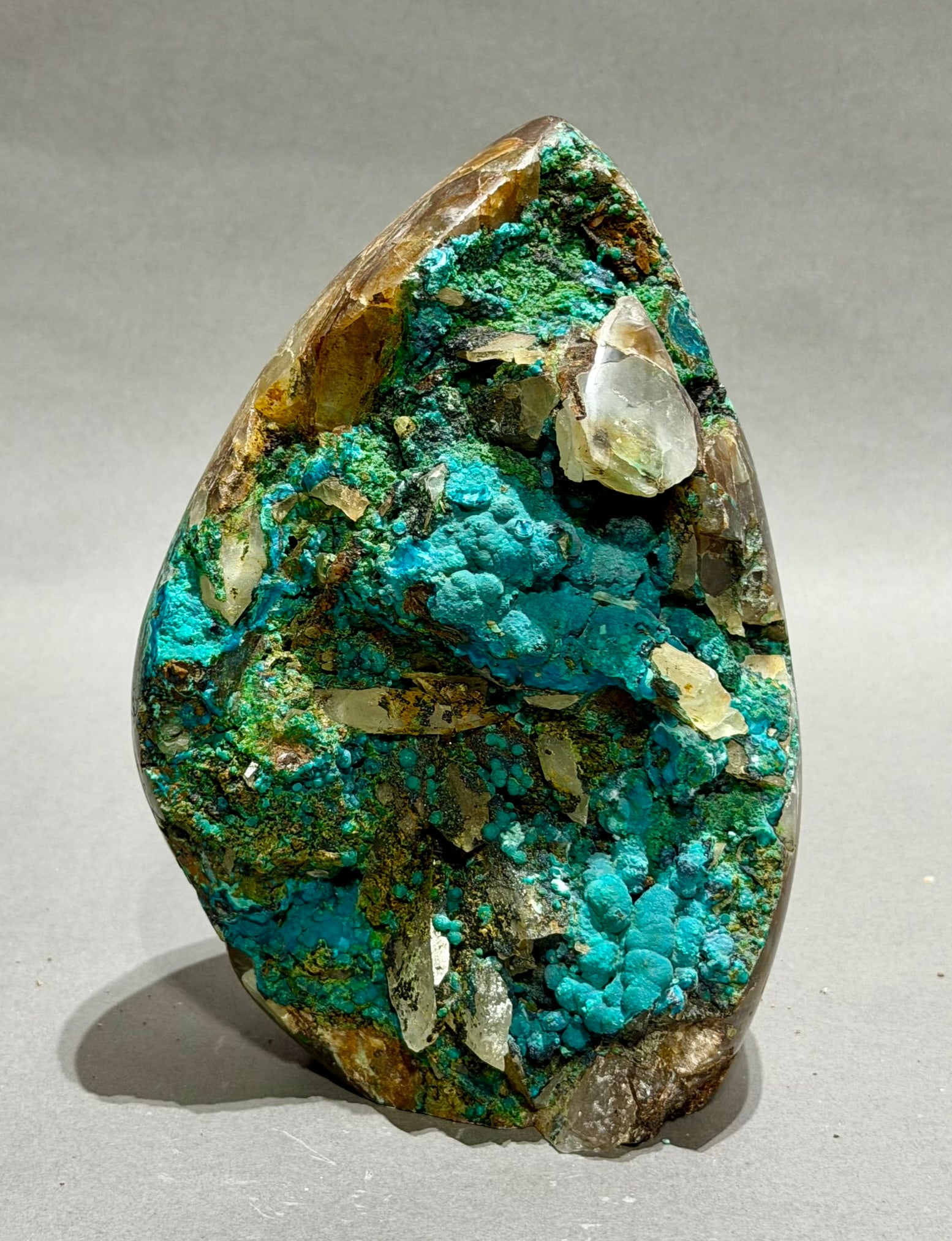 Rare Chrysocolla, Hematite and Quartz Egg: Rare fluorescent chrysocolla, hematite, and quartz egg from the Tentadora Mine in Peru. 7.5" x 5" x 3.5". 5.36 pounds.