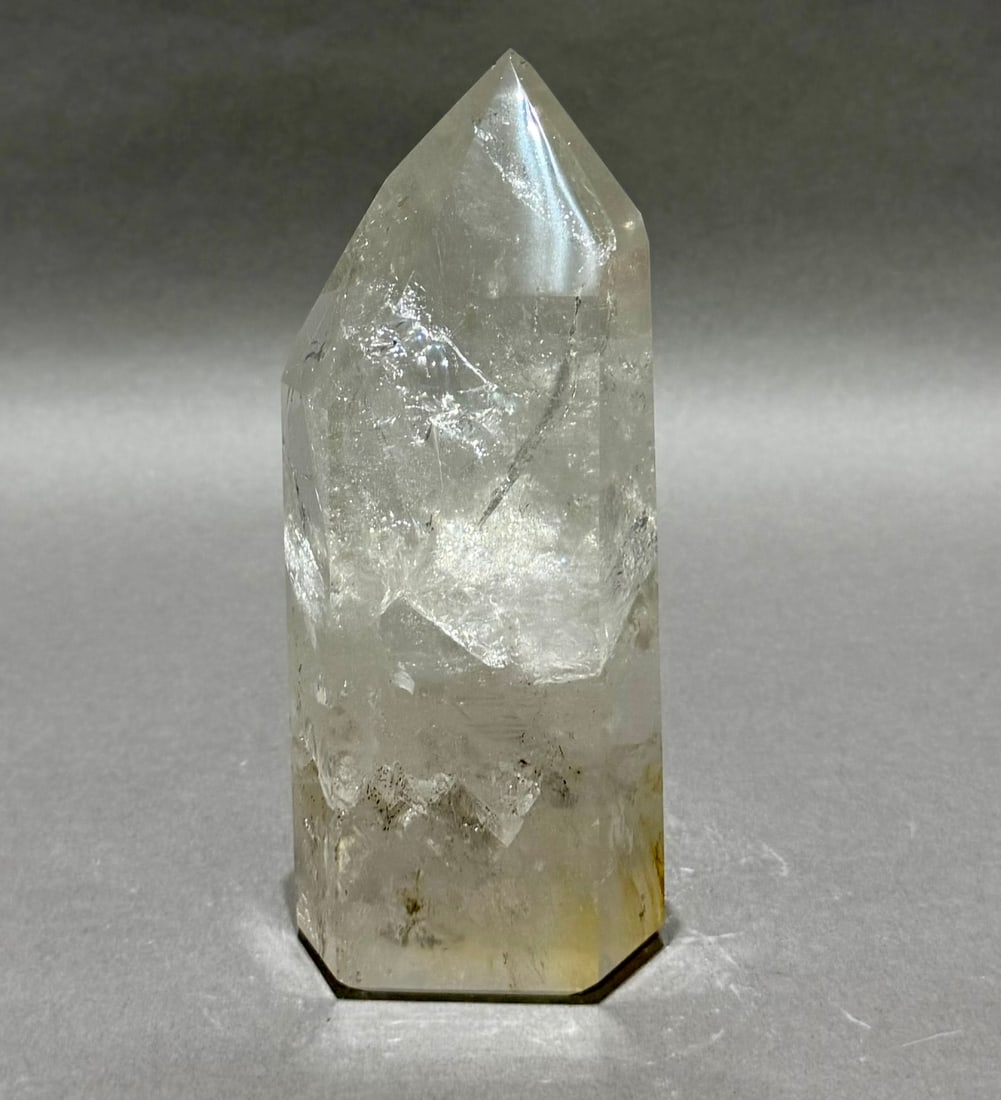 Top Quality Clear Quartz Crystal Obelisk With Inclusions: Top quality clear quartz crystal obelisk with refractive inclusions from Brazil. 7” x 3” x 2”. 2.32 lbs.