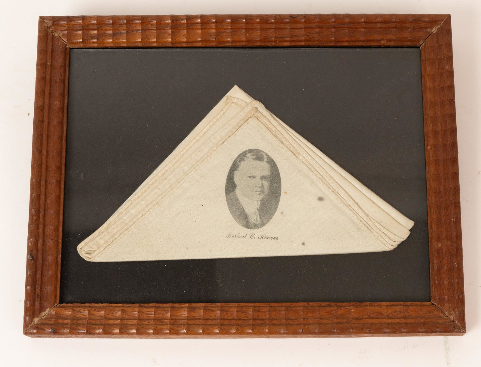 Herbert Hoover Presidential Handkerchief.: This item is framed and has a printed face of the President with his name printed below. Item was not removed from frame for inspection. Measures 10-1/4" x 8" x 3/4"d.