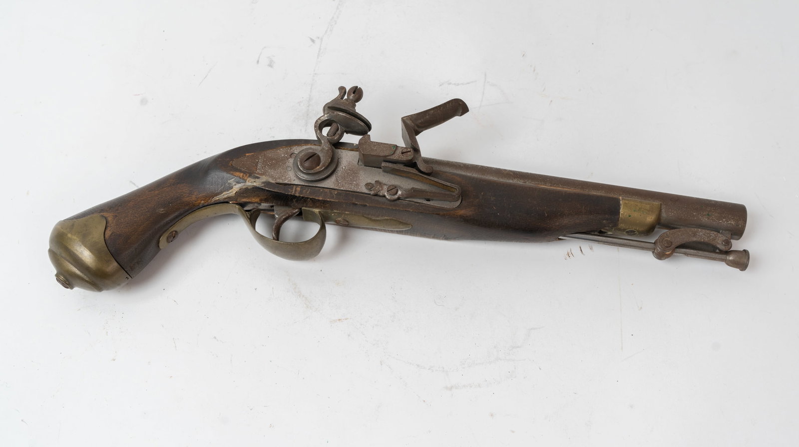 Reproduction Tower Flintlock Pistol.: Mid century kit pistol with the stamping on lock plate "Tower" and a Crown GR stamp under the pan. Barrel measures 8-1/4" with a .48 Cal smooth bore. Lock action functions. Crack in stock at L/S lower