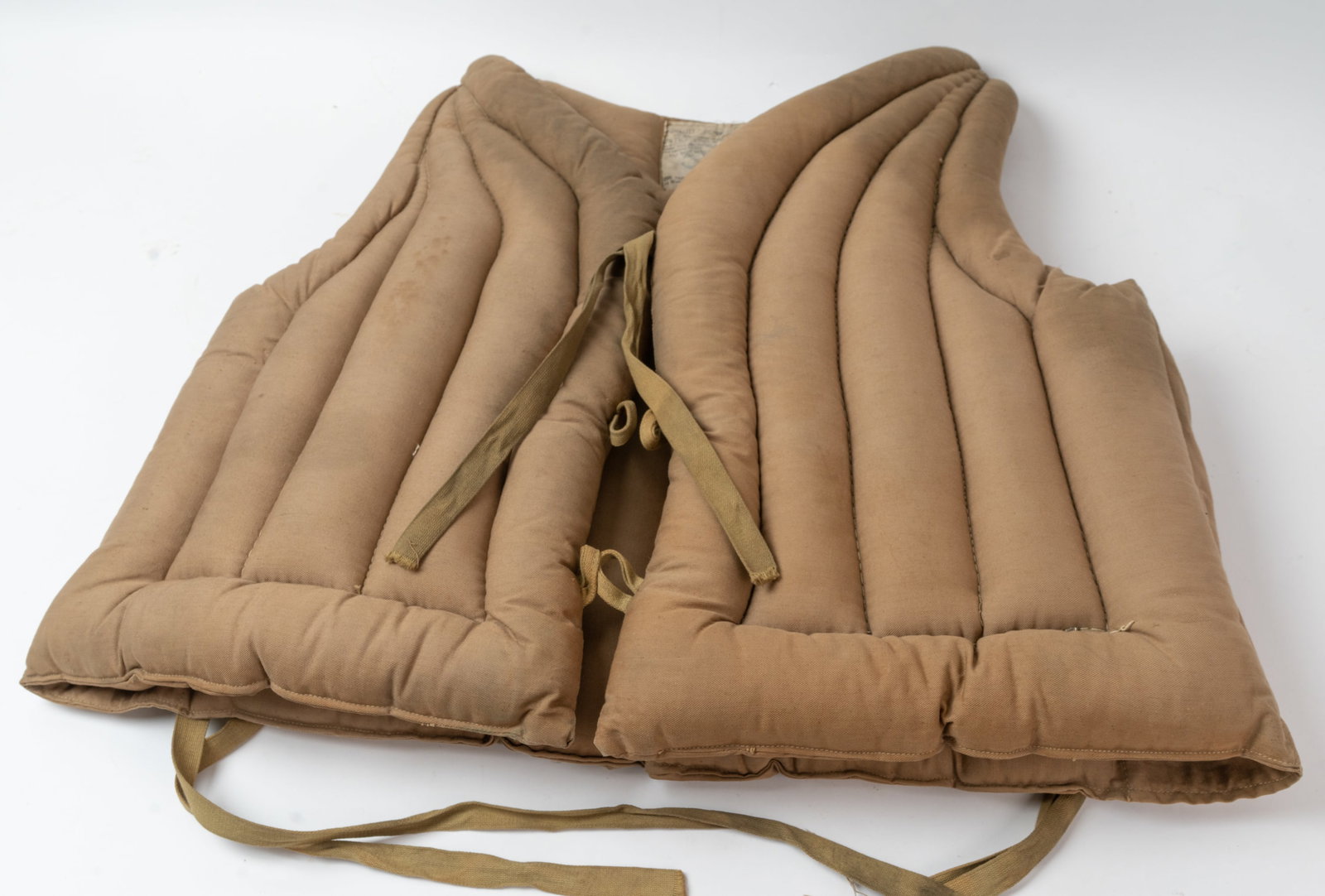 WWII U.S. Navy Transport Life Vest.: These Kapok vests were used on Troop Transport and Carriers for transporting soldiers. Made by the Cluff Fabric Products Co. SIze #4 and its in nice condition with an oil type stain to the L/S rear of