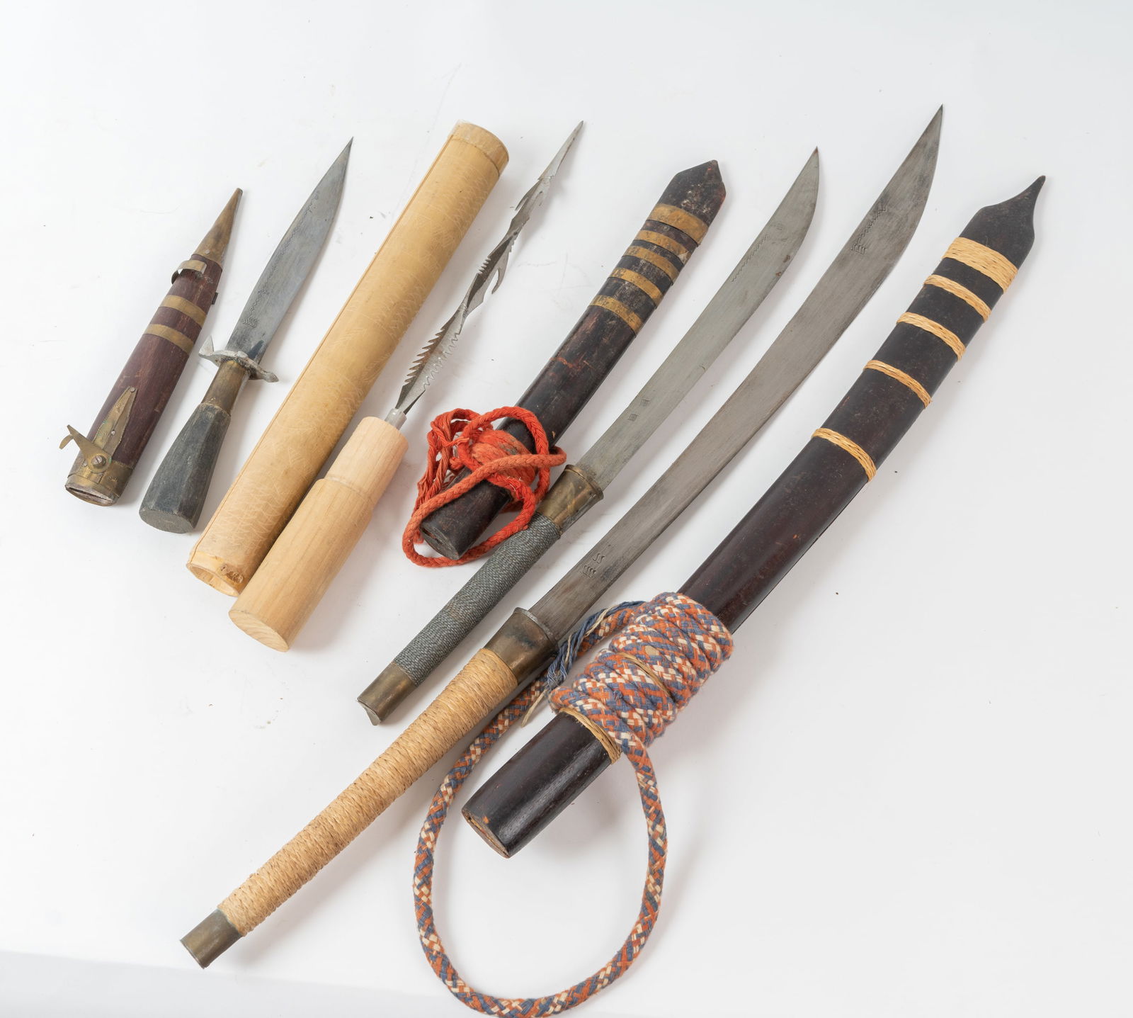 Lot of Four Antique Daggers and Swords.: Each one has a wood scabbard and several have blade markings which may be the makers. The largest one measures 29" overall with scabbard and smallest one measures 12-1/2" overall with scabbard.