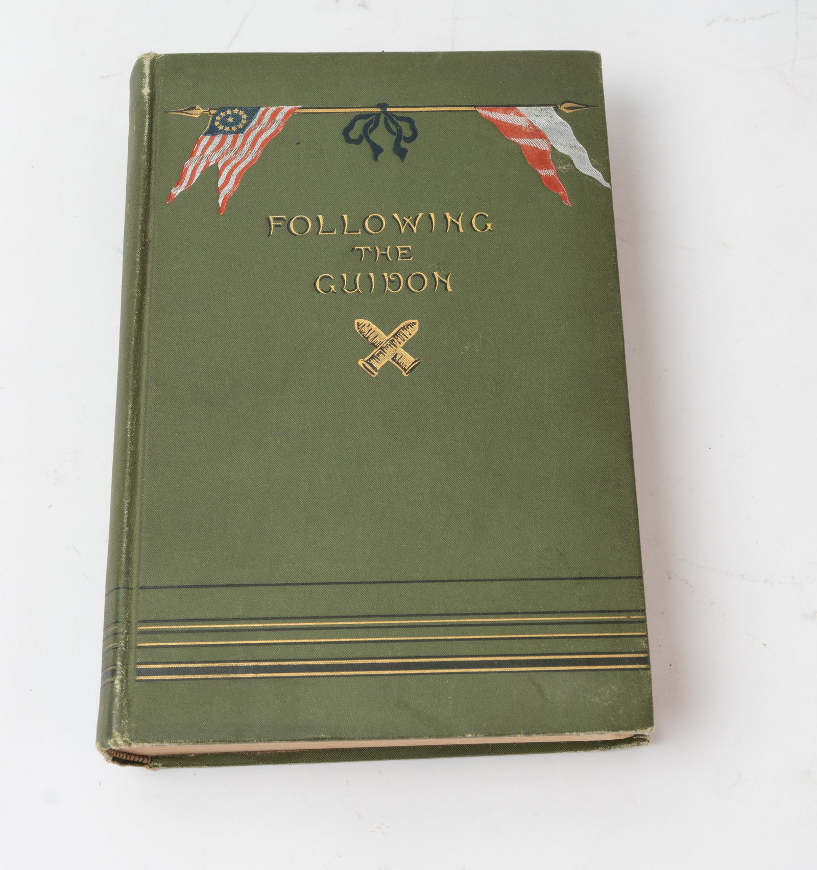 Following The Guidon Custer Book 1890.: First edition hardcover by Elizabeth B. Custer with illustrations printed by Harper & Brothers in New York 1890. Inside front cover has the name "Musgrave" in pencil with old tape holding the second p