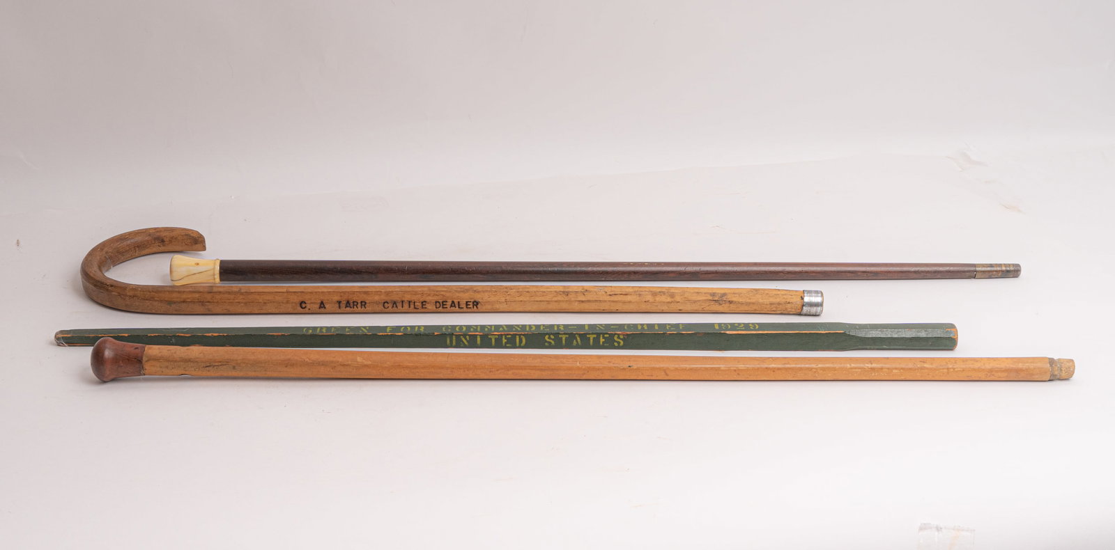 Grouping of Four Antique Canes.: A Military U.S. Spanish American War Veterans political cane with the following stenciled in yellow on Army green paint "United States Spanish American War Veterans Denver Colo. Green For Commander - 