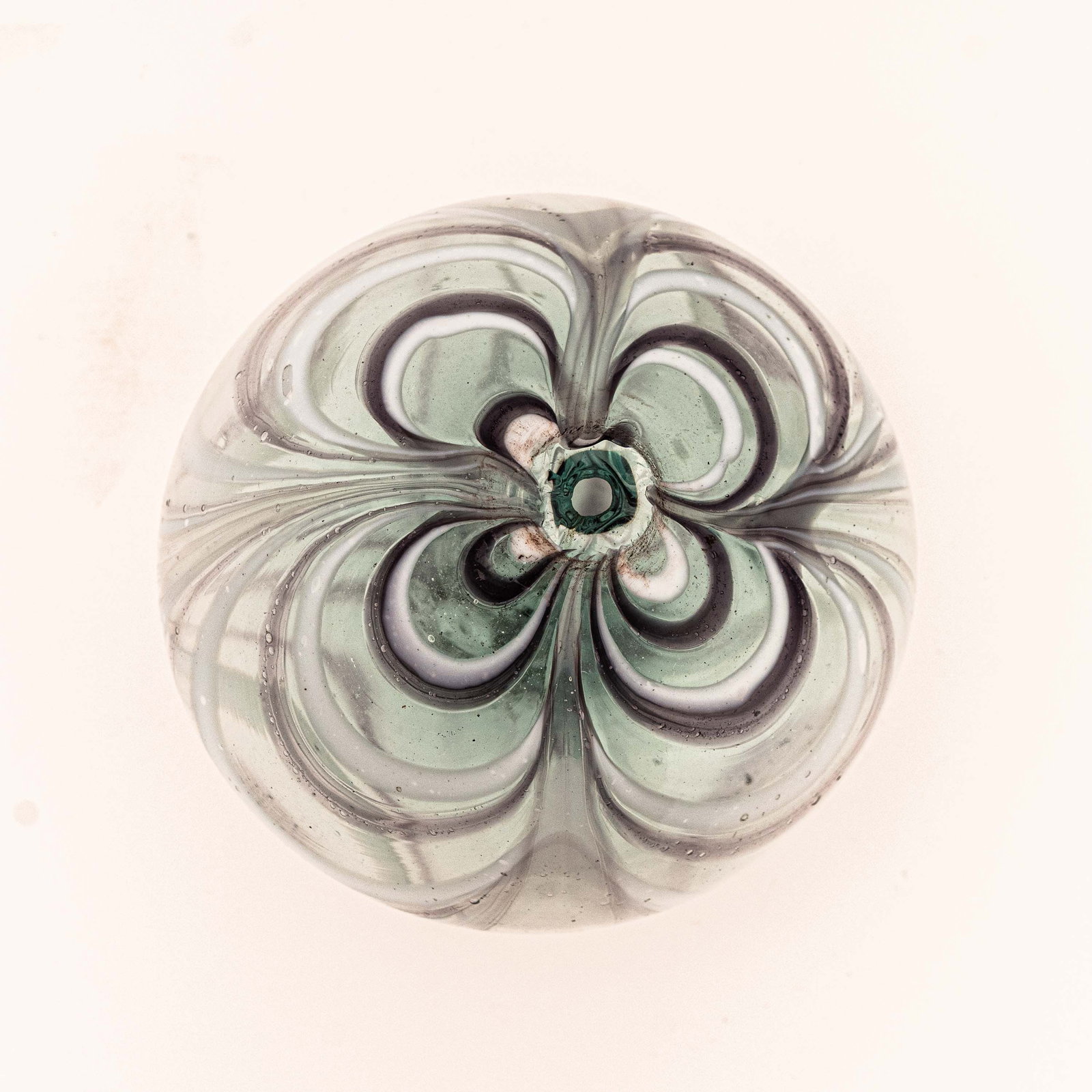 American Glass Witch Ball.: Beautiful white and amethyst color looping, 19th-C. Measures 3-3/4" with a 5/8" pontil scar.