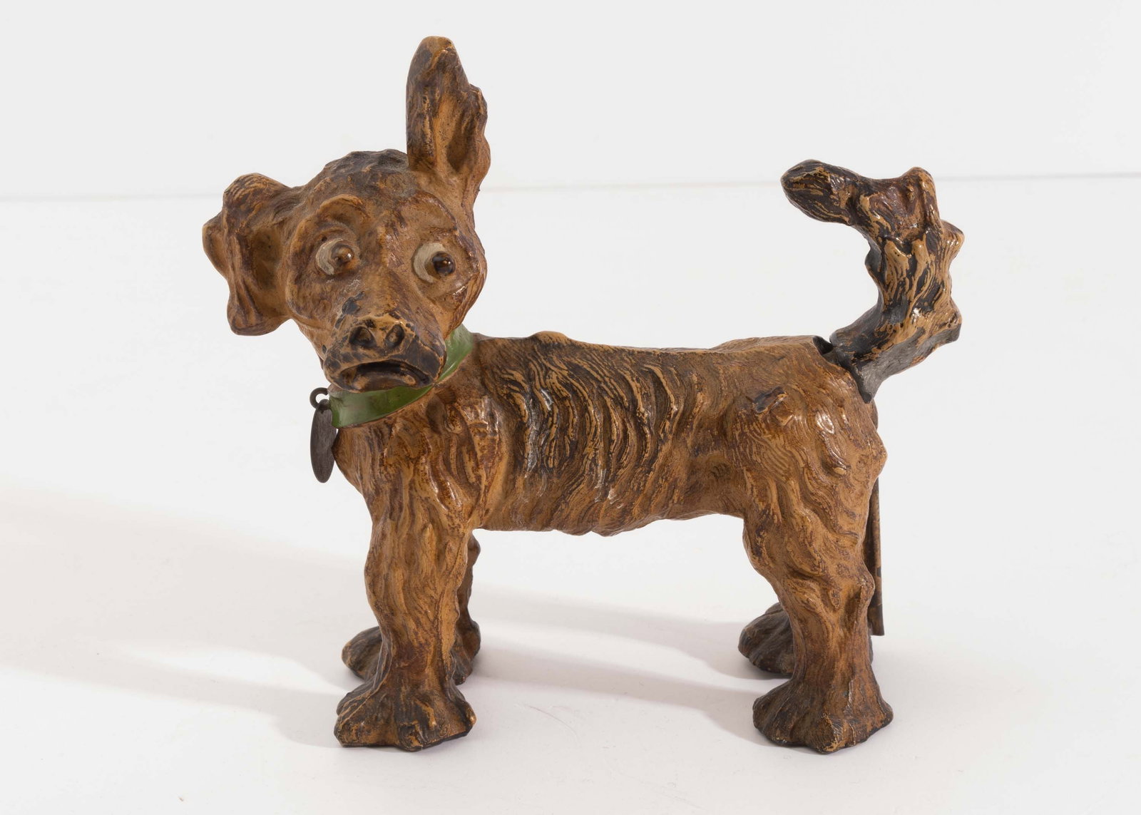 Antique Ronson Tipperary Pup Lighter.: Original paint and hang tag collar present. Some paint loss at tail rest and high spots, missing striker strip. Has dirt and grime throughout. Measures 5-1/2" long x 5-1/2" high and weighs 1.3 lbs.