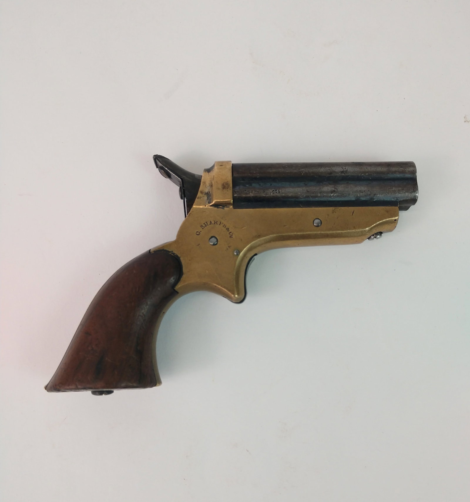 Civil War Era Sharps Pepperbox Pocket Pistol.: Four barrel percussion pistol with wood grips stamped "C. Sharps & Co." Serial# 17895 stamped on bottom strap at grip. Some blueing remains on approx. .22 Cal barrels. Hammer and trigger float the mai